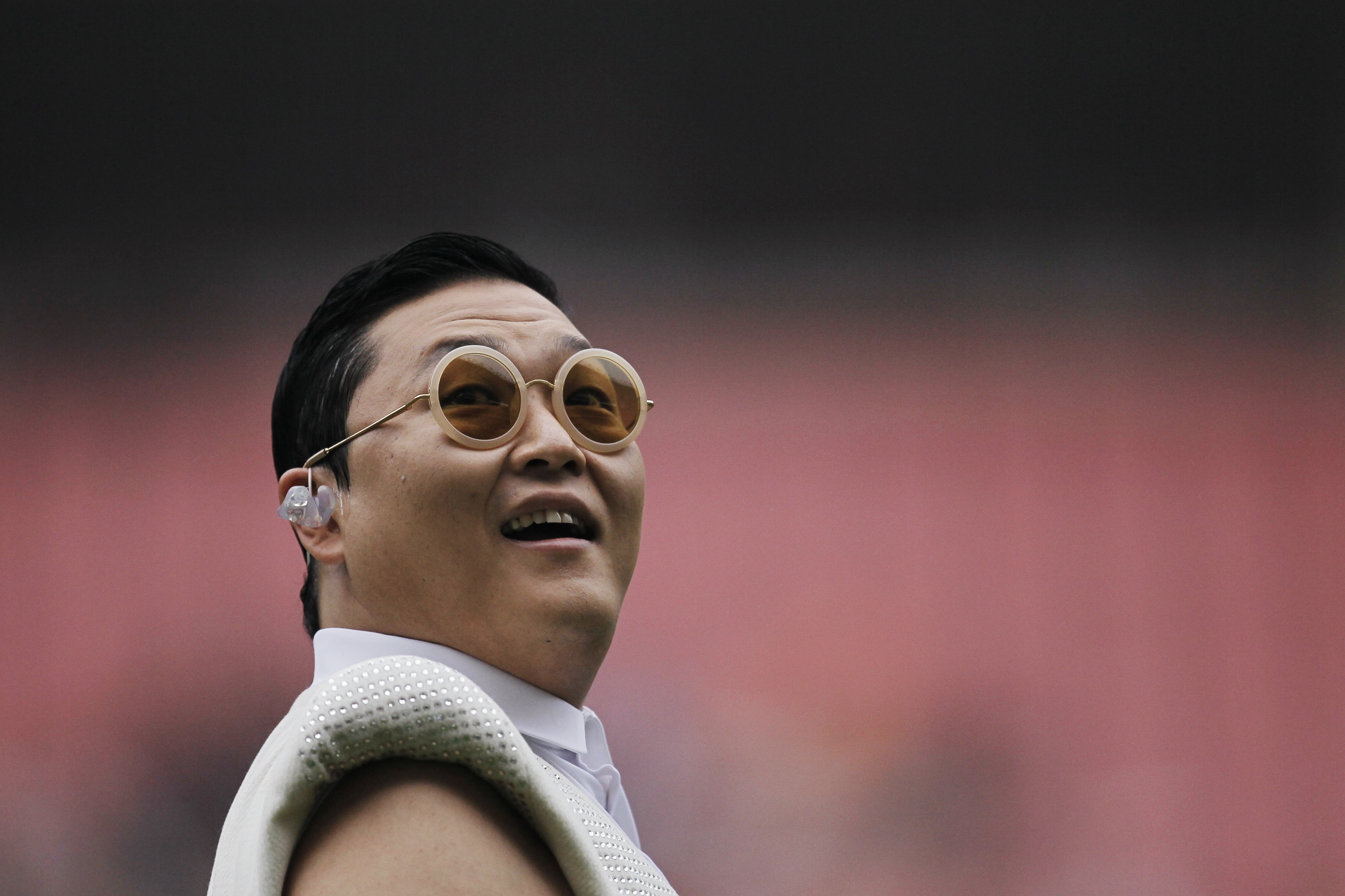 South Korean singer Psy performs during a charity soccer match between the Park Ji-sung and Friends team and Shanghai Laokele Stars in Shanghai
