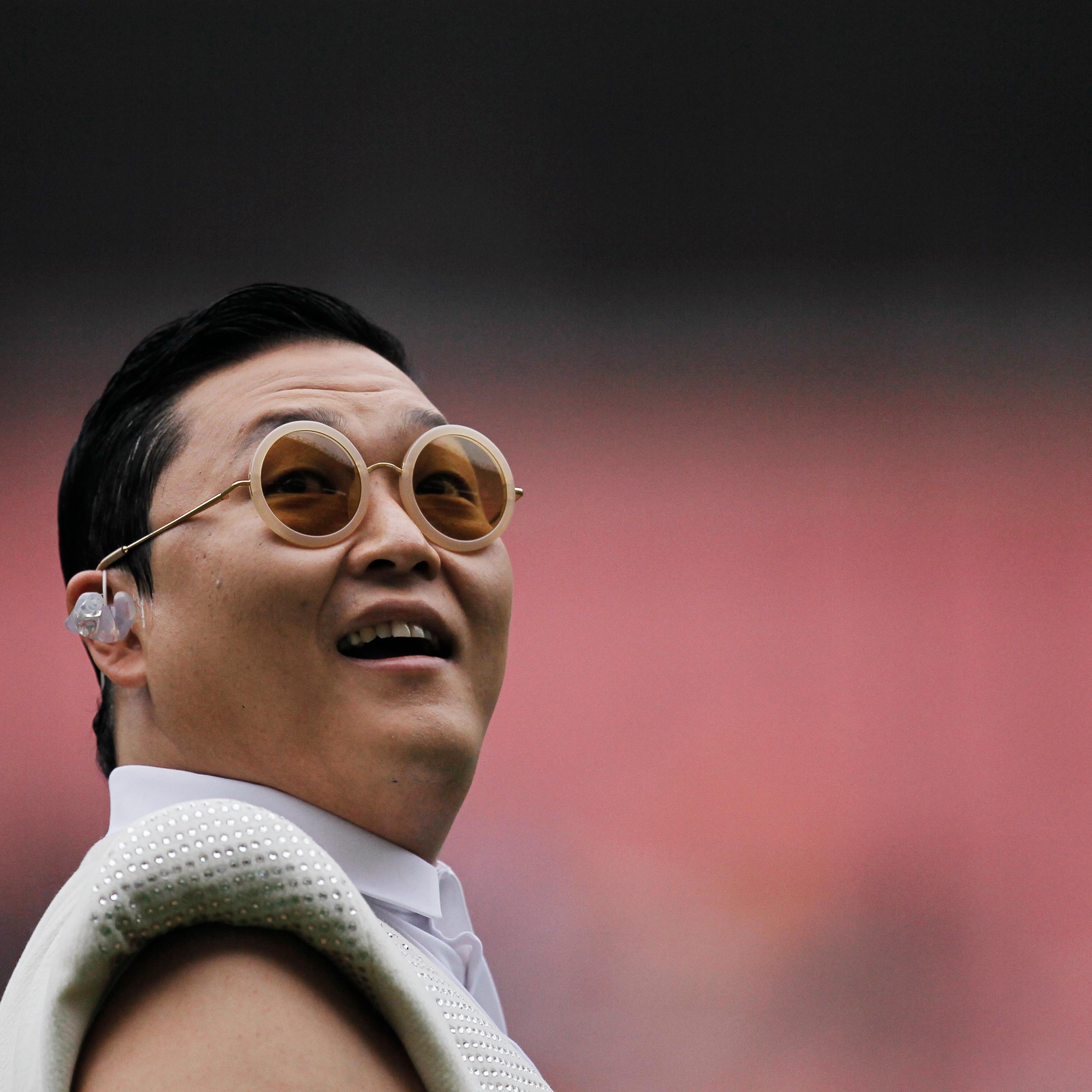South Korean singer Psy performs during a charity soccer match between the Park Ji-sung and Friends team and Shanghai Laokele Stars in Shanghai