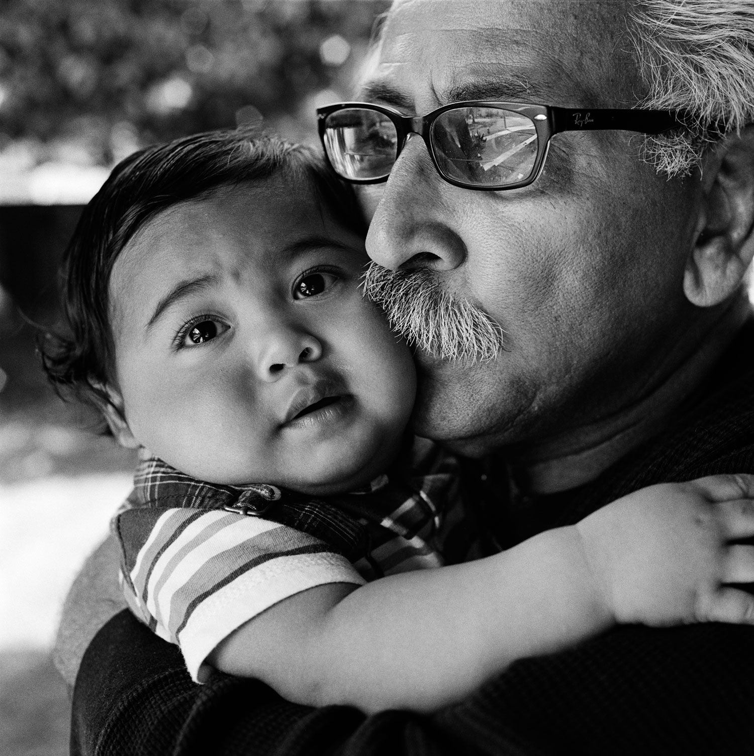 Jesse was emotionally neglected as a child and he feels it’s important that his grandson, Lorenzo, does not suffer from neglect. Stockton, Calif., 2012.