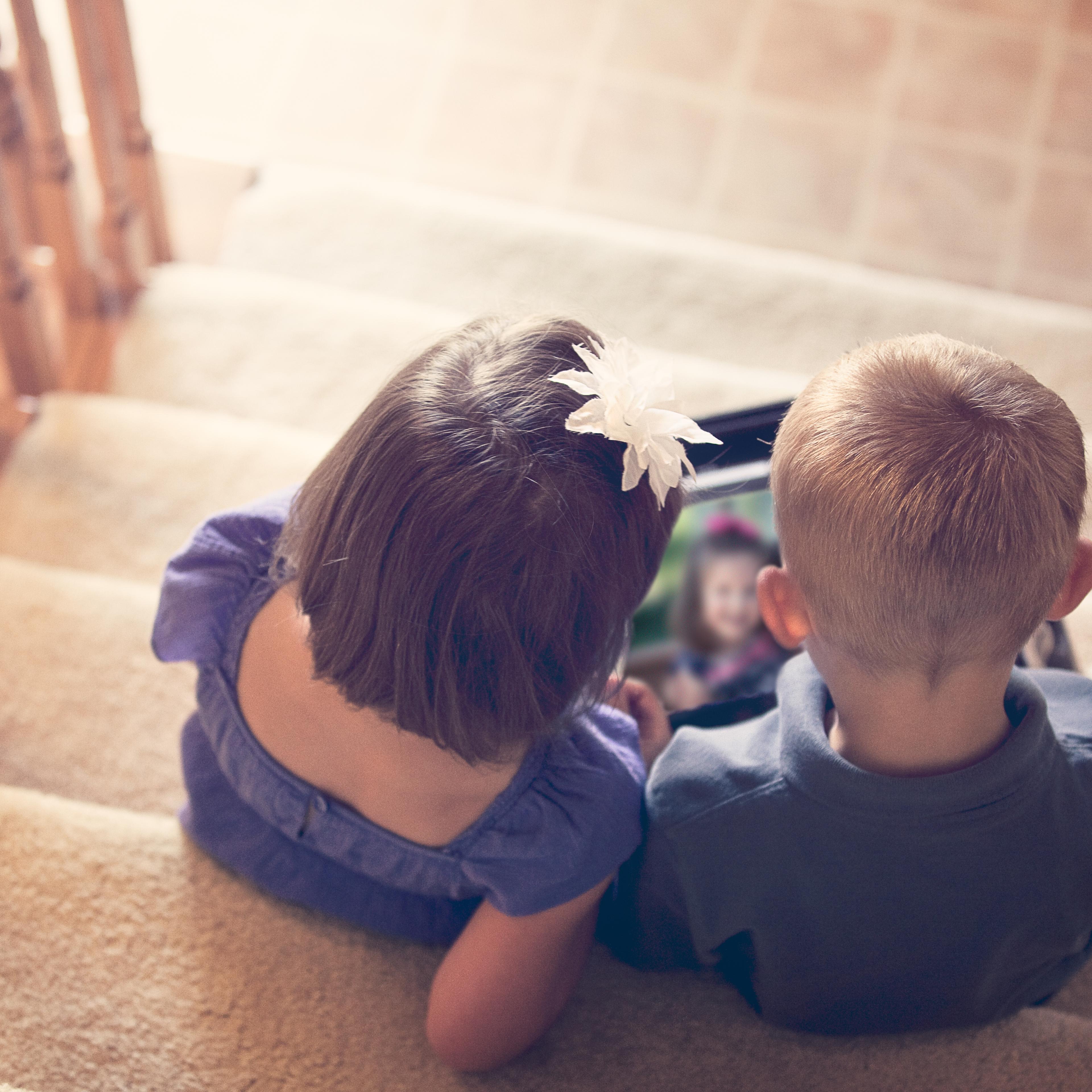 Children looking at photo