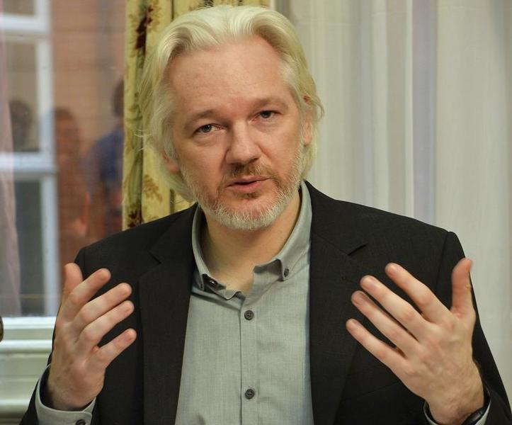 WikiLeaks founder Julian Assange gestures during a news conference at the Ecuadorian embassy in central London, Aug. 18, 2014.