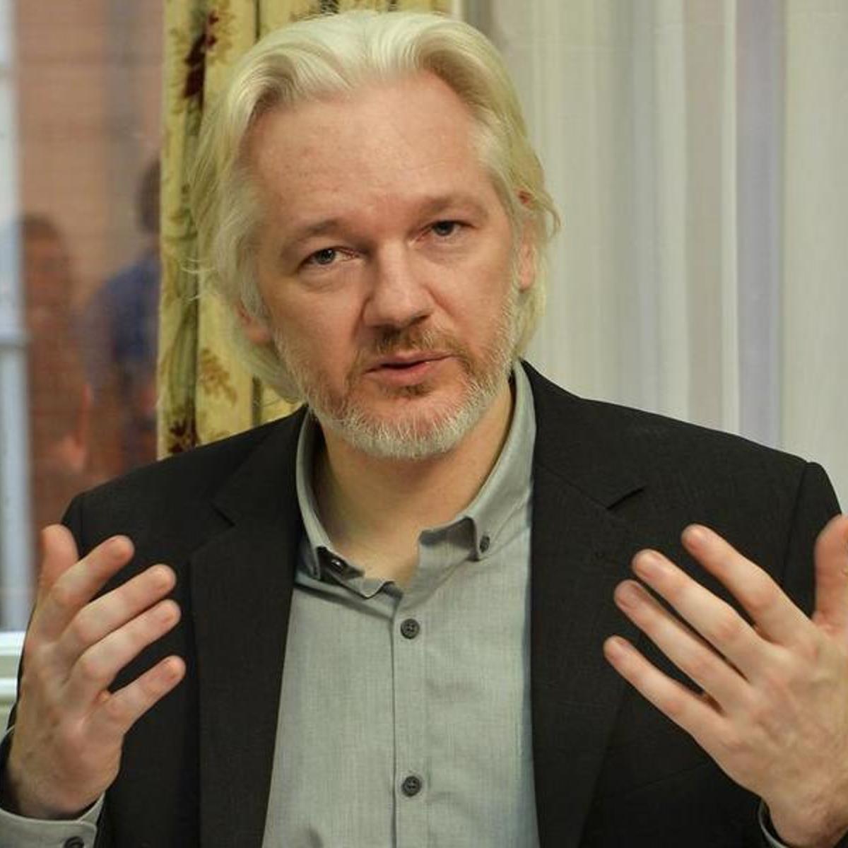 WikiLeaks founder Julian Assange gestures during a news conference at the Ecuadorian embassy in central London, Aug. 18, 2014.