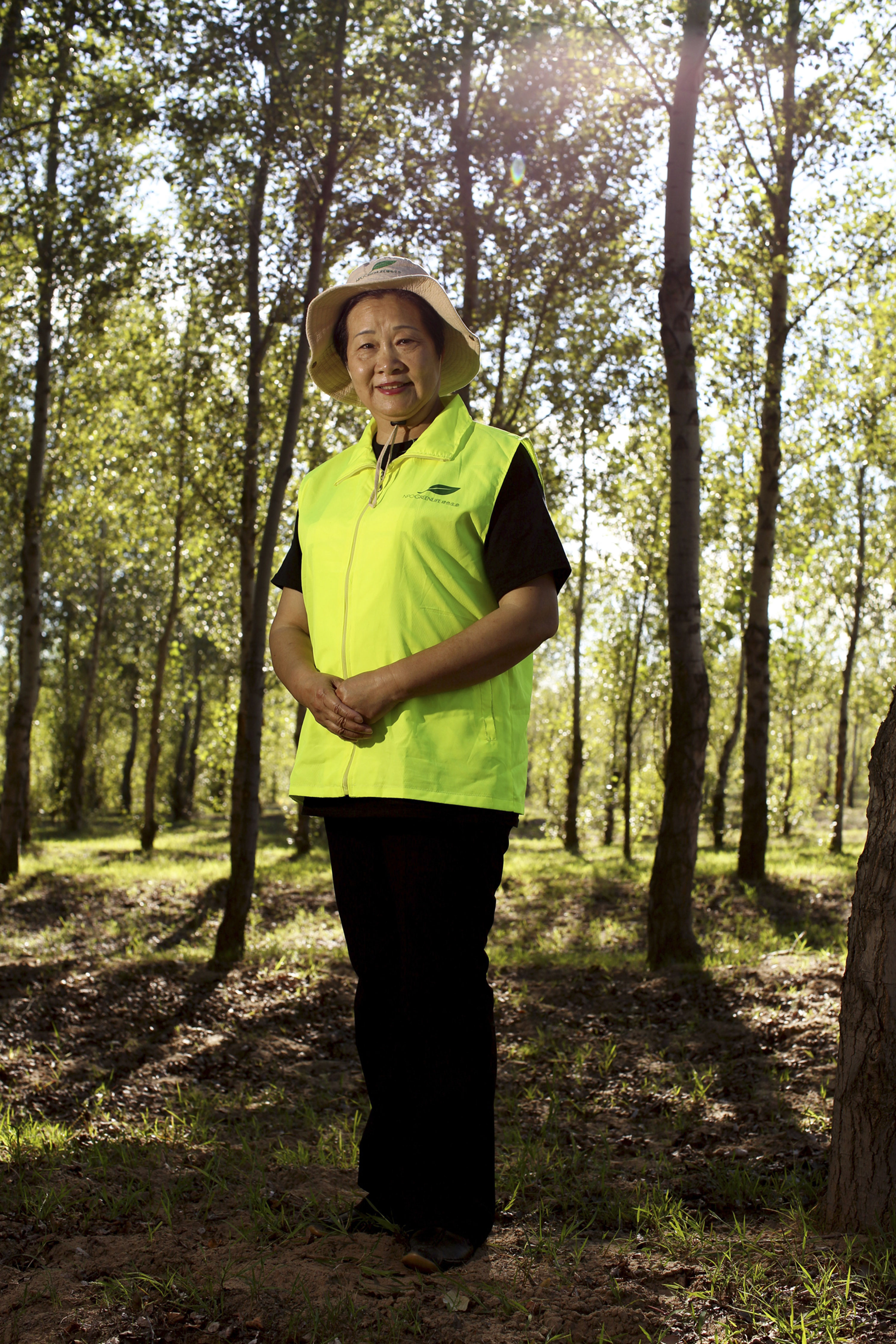 Since 2001, Yi and her Green Life NGO have planted countless numbers of trees