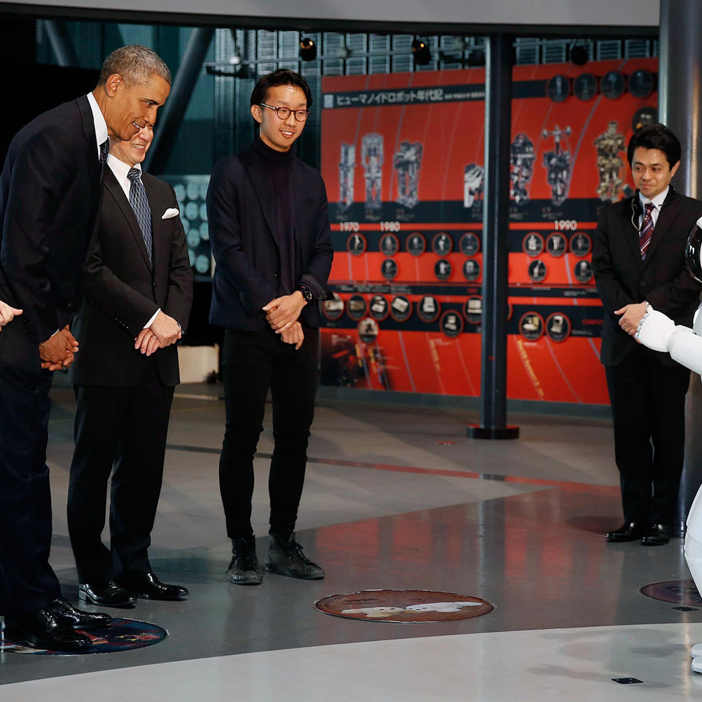 President Barack Obama bows to "Asimo" the robot while visiting Miraikan or the National Museum of Emerging Science and Innovation, in Tokyo, April 24, 2014.