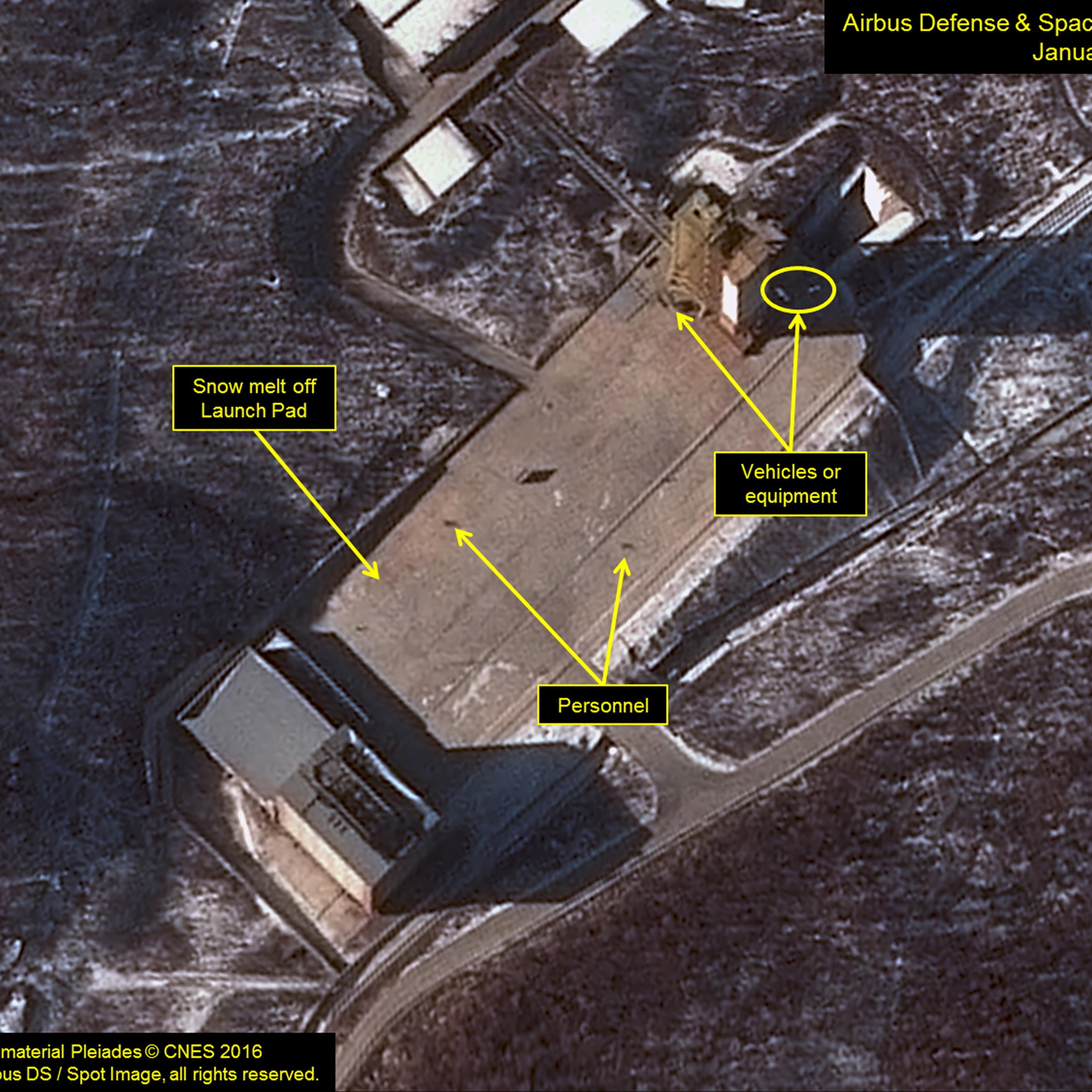 Airbus Defense & Space and 38 North satellite image shows three objects at the base of the gantry tower that are either vehicles or equipment at Sohae Satellite Launching Station in North Korea