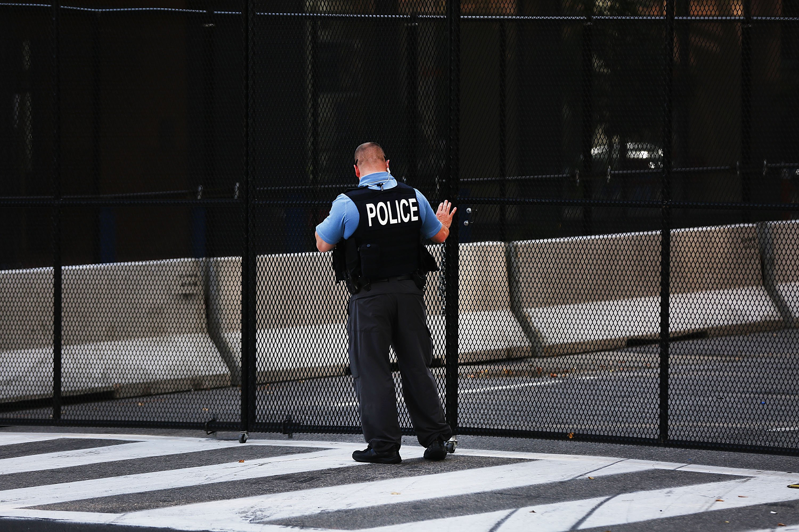 Police keep guard ahead of the Republican National Convention in a downtown filled with security barriers and closed roads in Cleveland, Ohio, July 17, 2016.