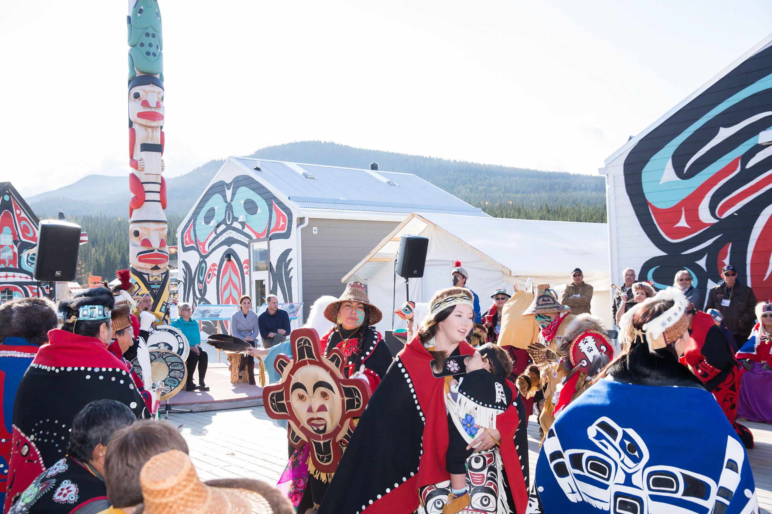 Prince William, Duke of Cambridge, and Catherine, Duchess of Cambridge, watch a cultural welcome in Carcross, Canada, on Sept. 28, 2016.