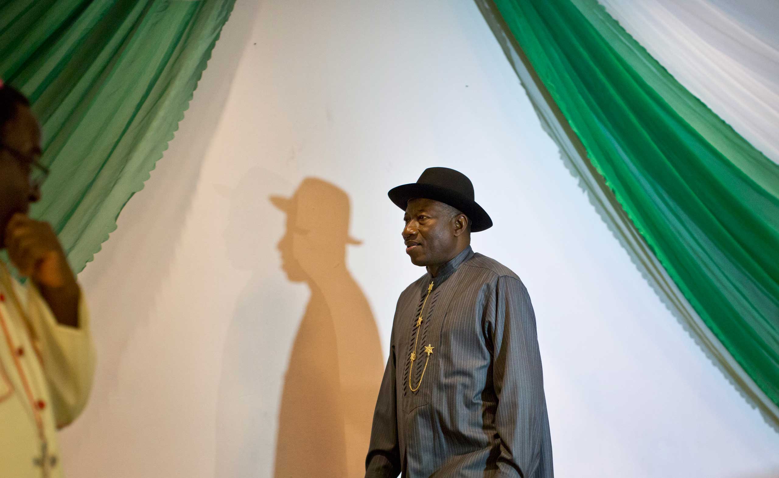 Nigerian President Goodluck Jonathan arrives on stage to sign a joint renewal with opposition candidate Gen. Muhammadu Buhari (not pictured) of their pledge to hold peaceful "free, fair, and credible" elections, at a hotel in the capital Abuja, Nigeria, 