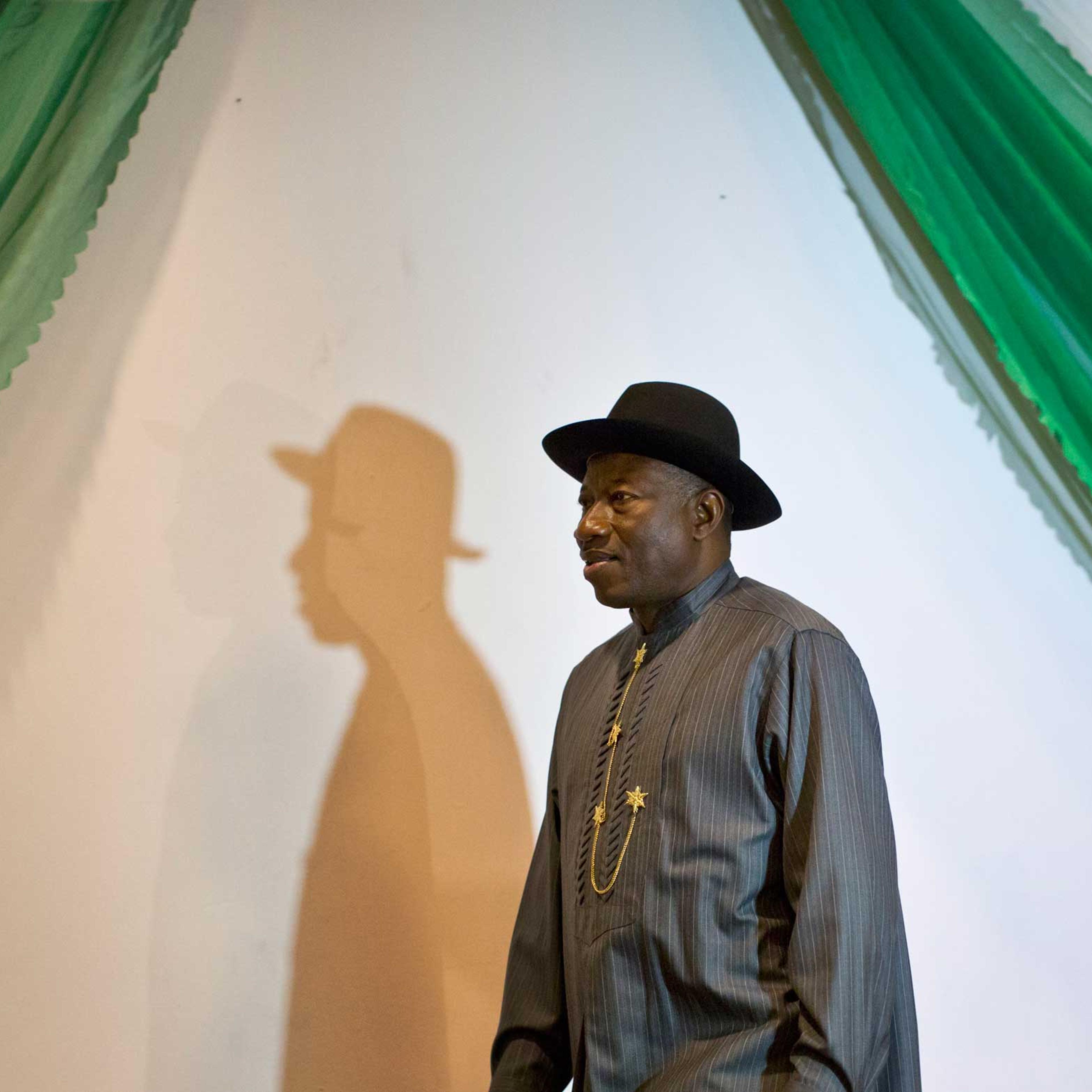 Nigerian President Goodluck Jonathan arrives on stage to sign a joint renewal with opposition candidate Gen. Muhammadu Buhari (not pictured) of their pledge to hold peaceful "free, fair, and credible" elections, at a hotel in the capital Abuja, Nigeria,