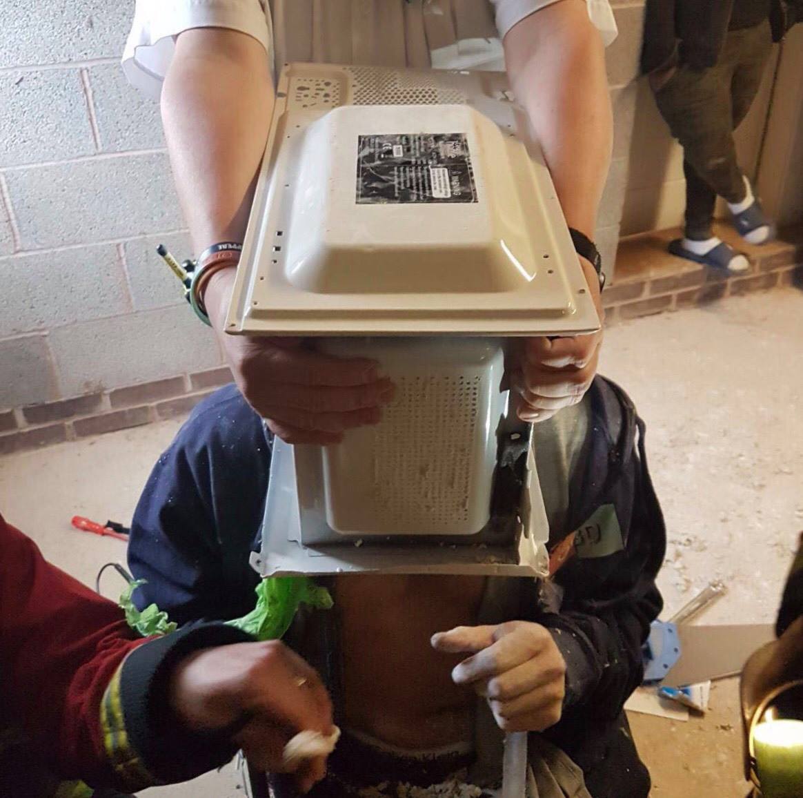 It took an hour to free the man from the microwave.