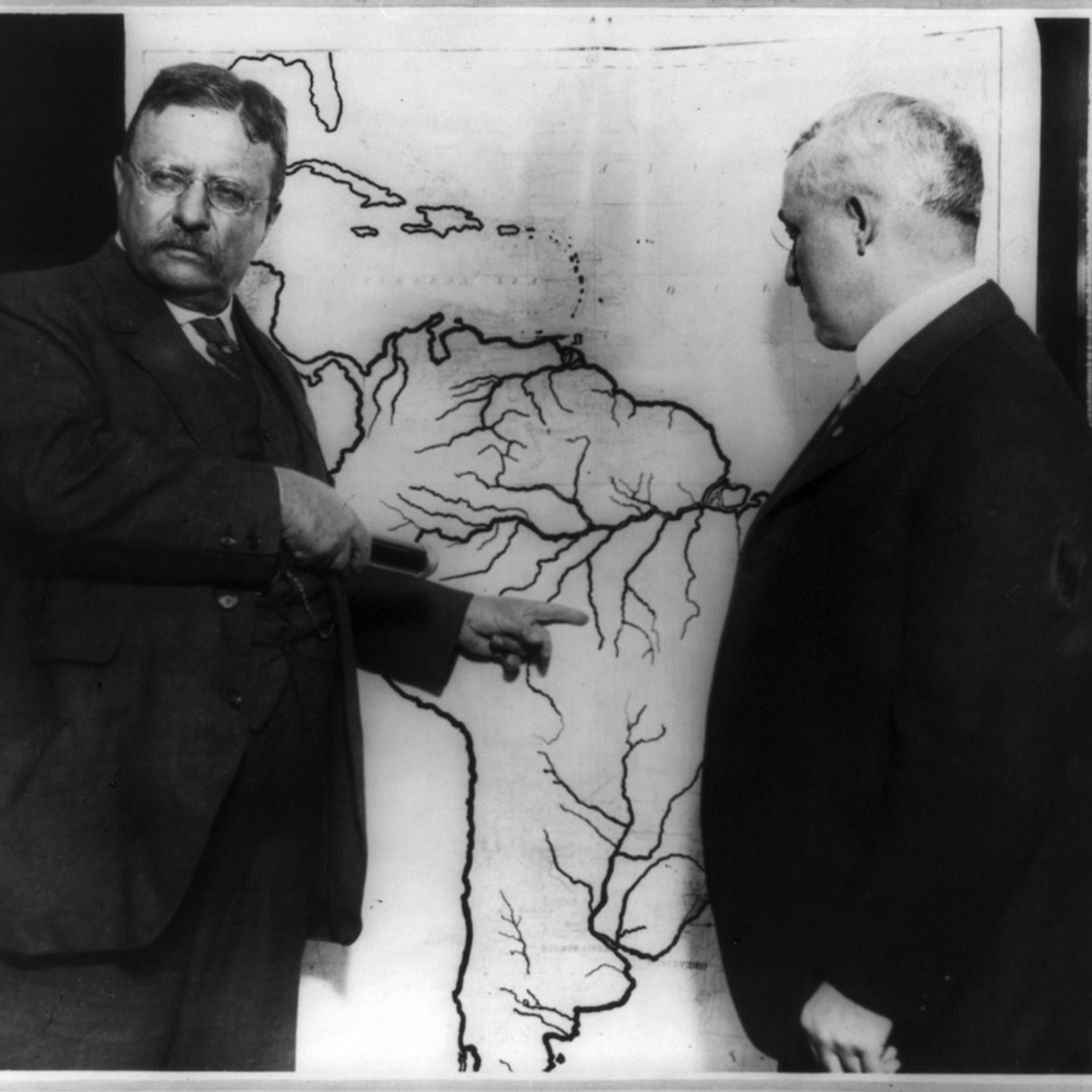 President Roosevelt pointing at a map of South America.