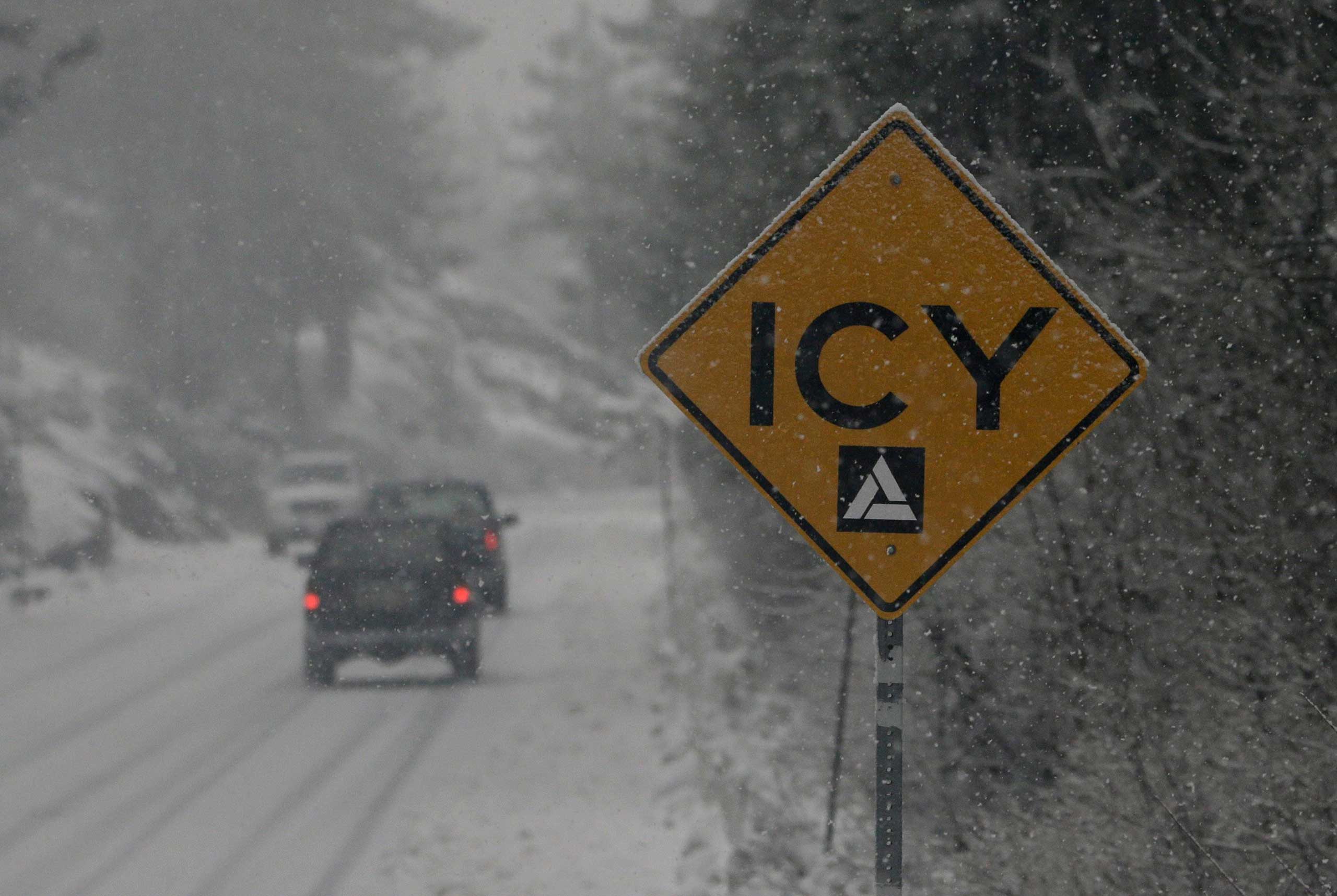 A sign warns drivers of the road conditions on Donner Pass Road near Soda Springs, Calif., Dec. 11, 2014.