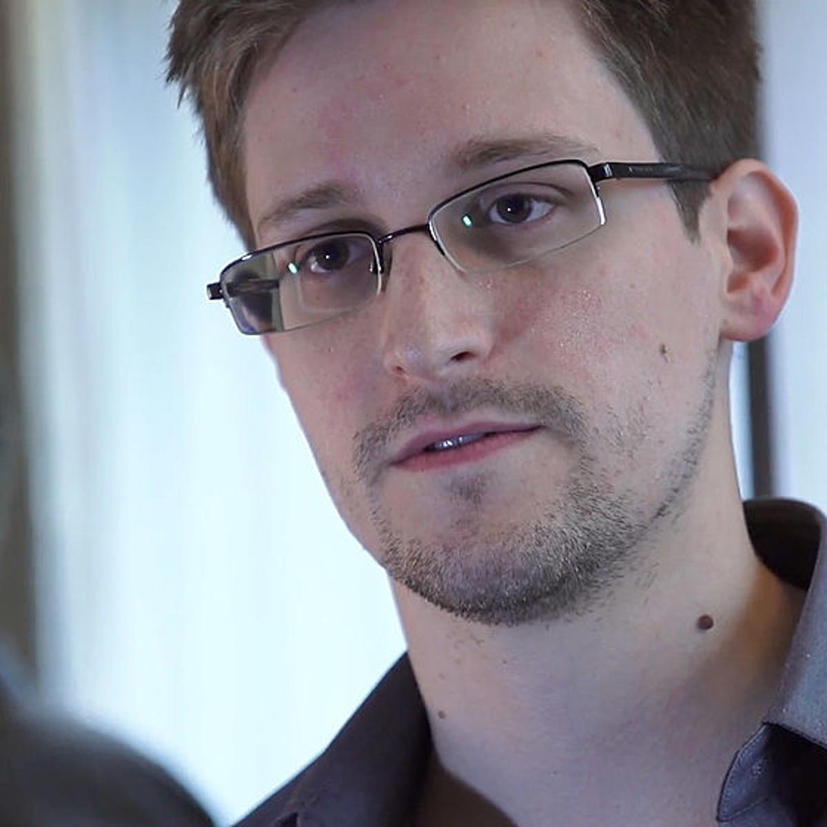 In this handout photo provided by The Guardian, Edward Snowden speaks during an interview in Hong Kong.