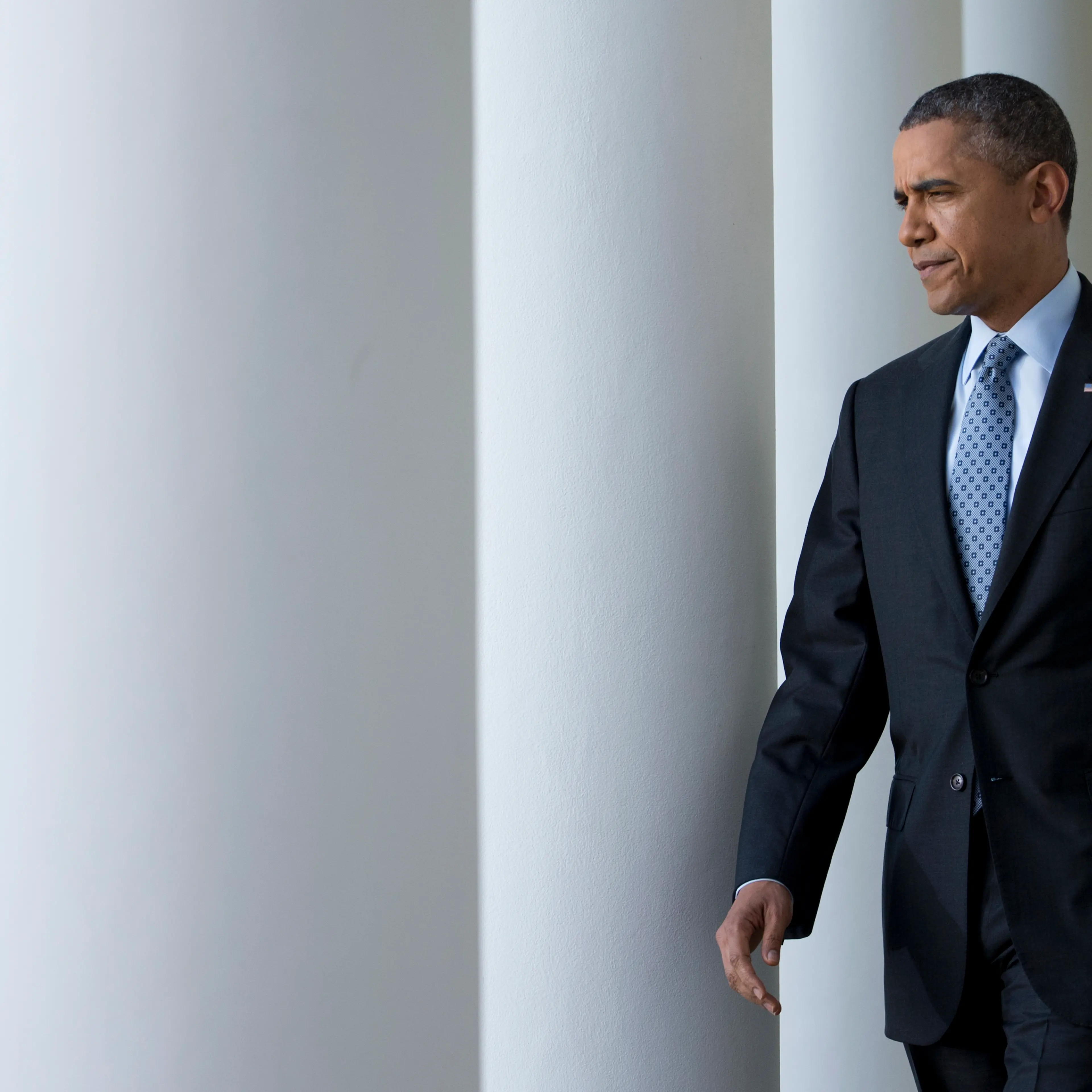 President Barack Obama walks from the Oval Office to the Rose Garden of the White House in Washington, April 1, 2014.