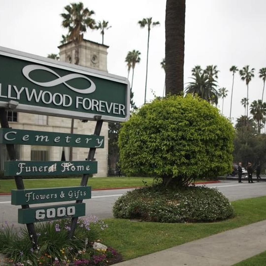 The front gate to the Hollywood Forever cemetery, where a memorial service for fashion designer L'Wren Scott, was held, is seen in Los Angeles