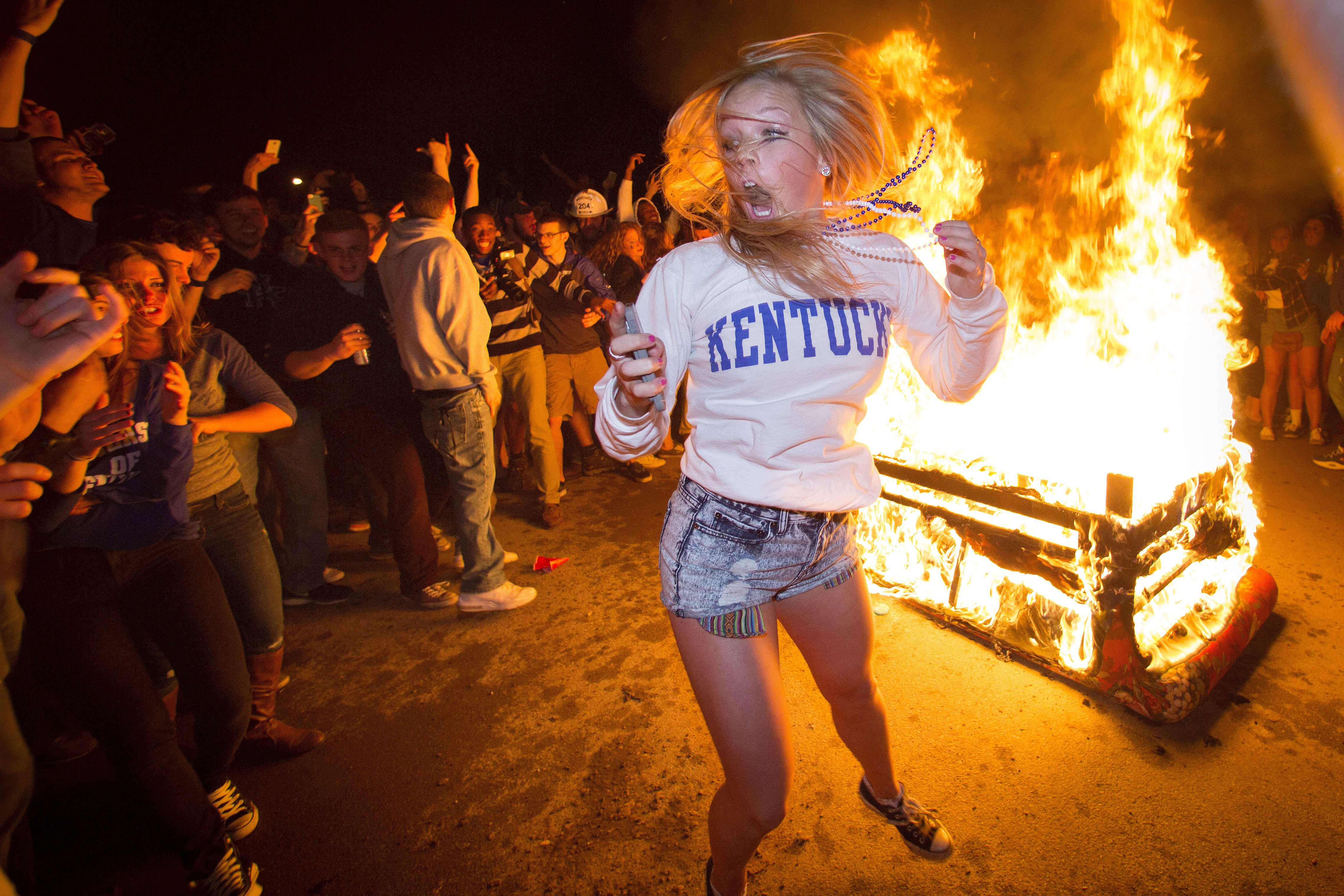 University of Kentucky fans celebrate on State Street after their team's come from behind victory over the University of Louisville to advance to the Elite 8 in the NCAA Men's Basketball Tournament on March 28, 2014.