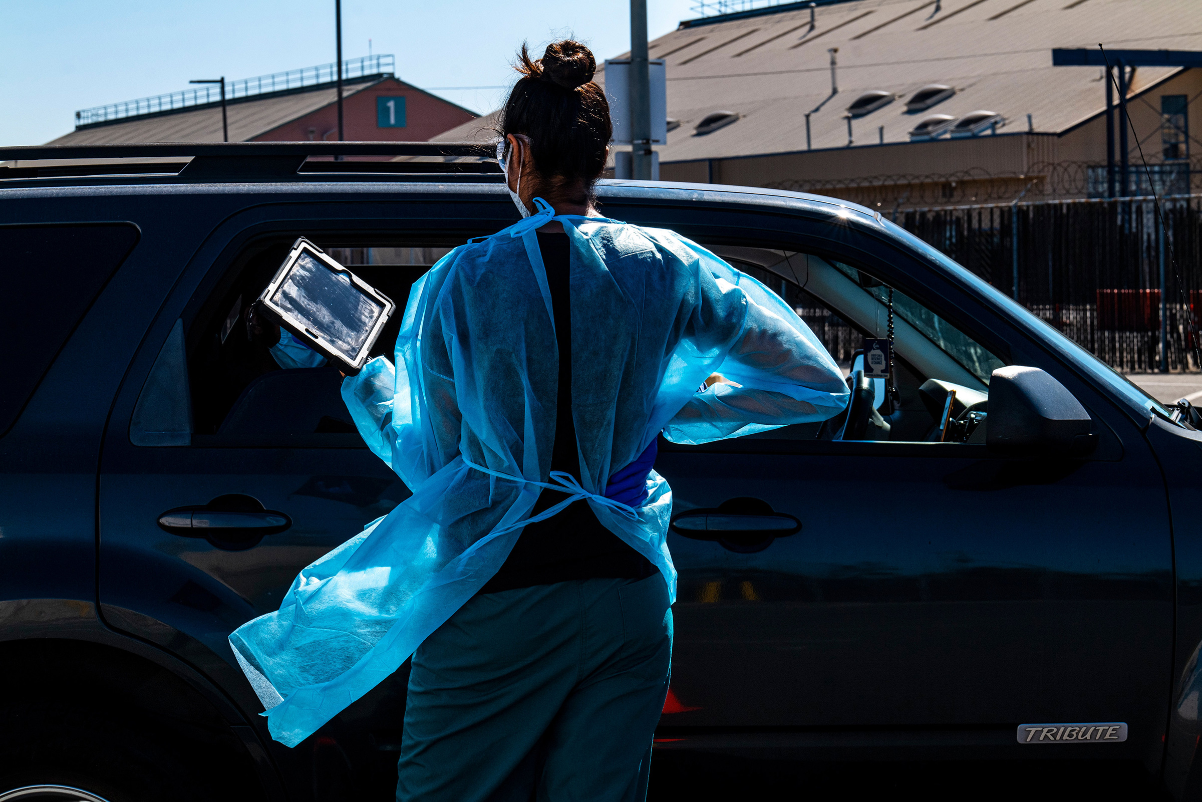 A medical worker interviews a person before administering a rapid Covid-19 test in Oakland, Calif., on Oct. 12.