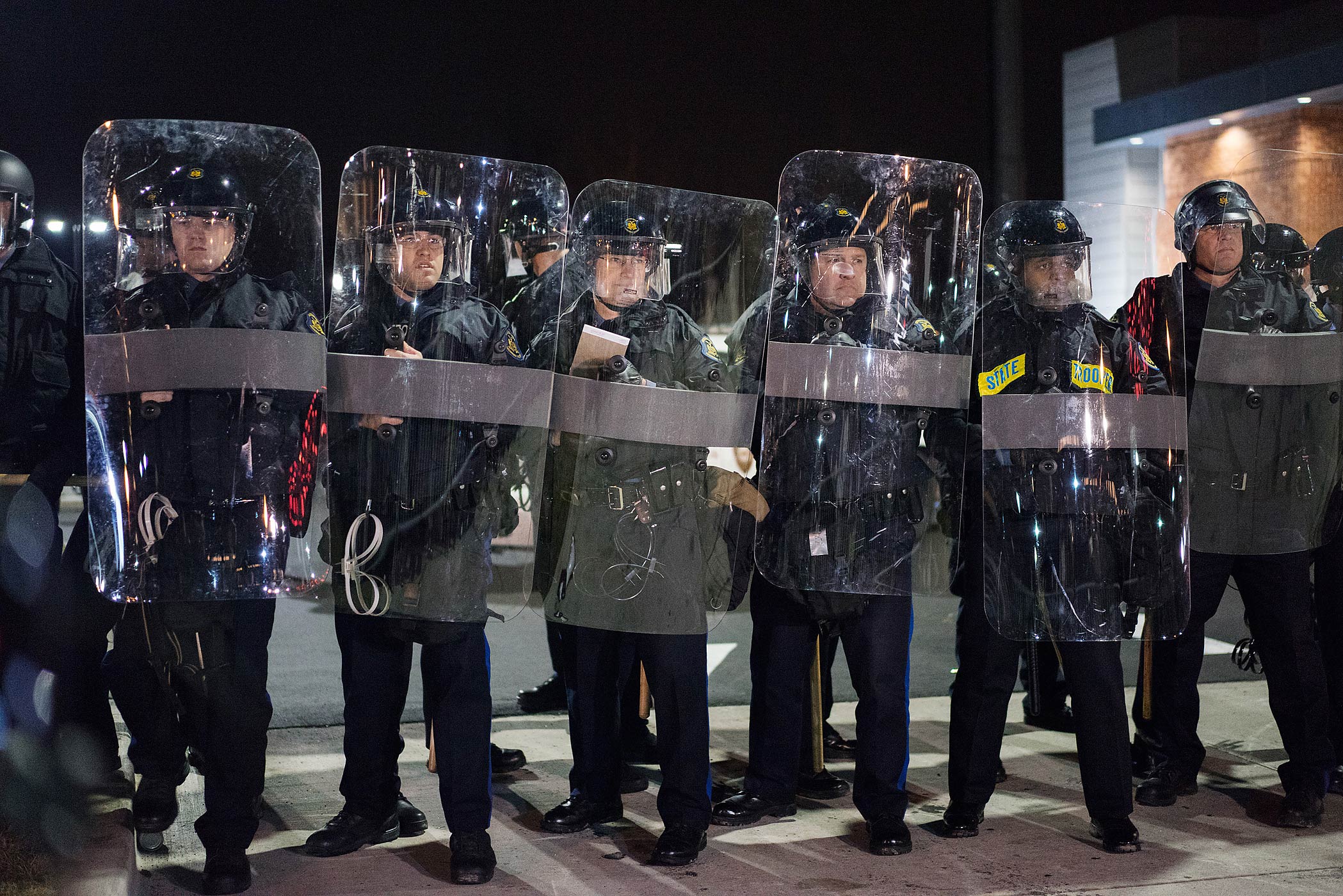 Police officers in riot gear stand guard in Ferguson, Mo. on Nov. 24, 2014