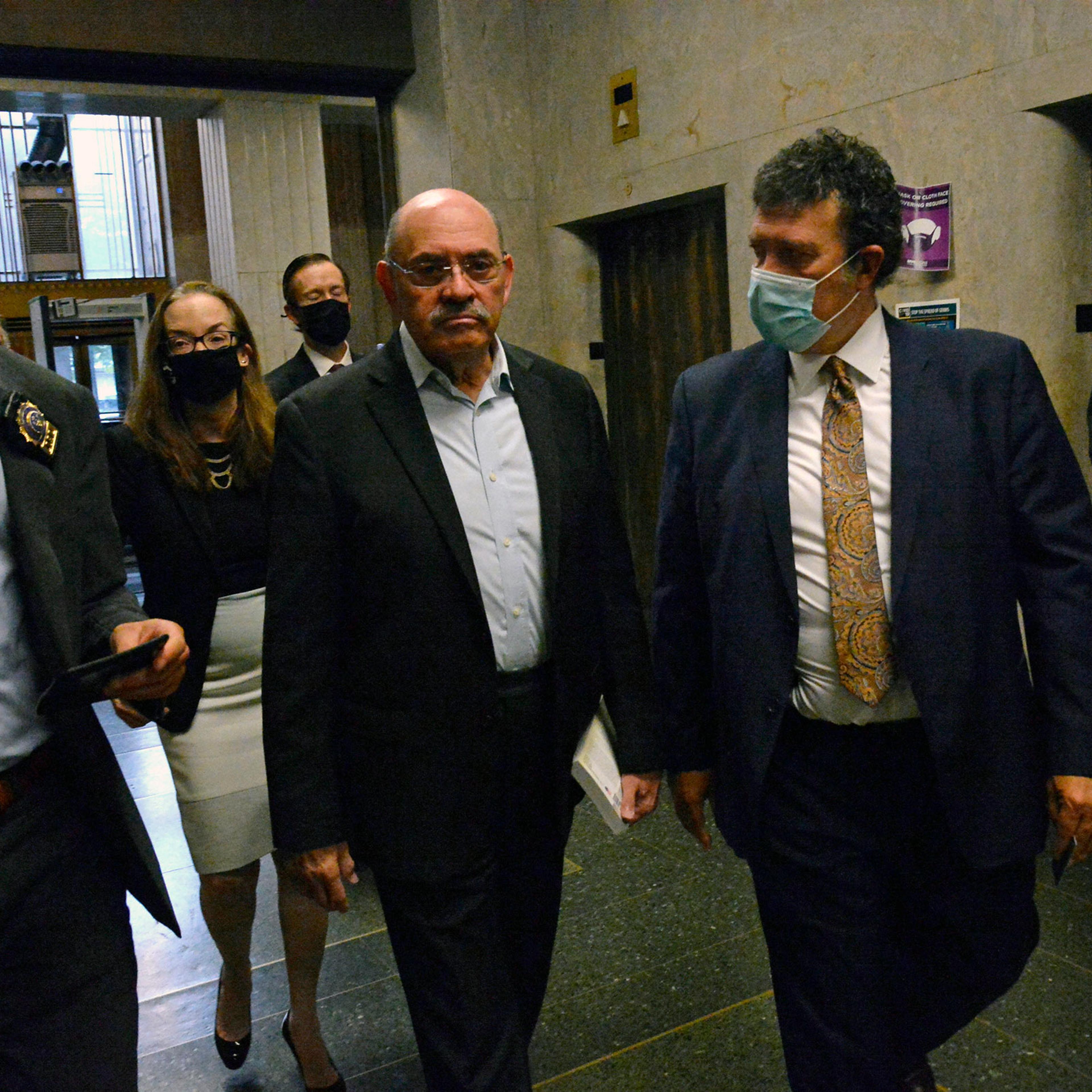 Allen Weisselberg, second from left, Donald Trump's long-serving chief financial officer, surrenders Thursday morning, July 1, 2021, at the lower Manhattan building that houses the criminal courts and the district attorney's office. (Jefferson Siegel/The