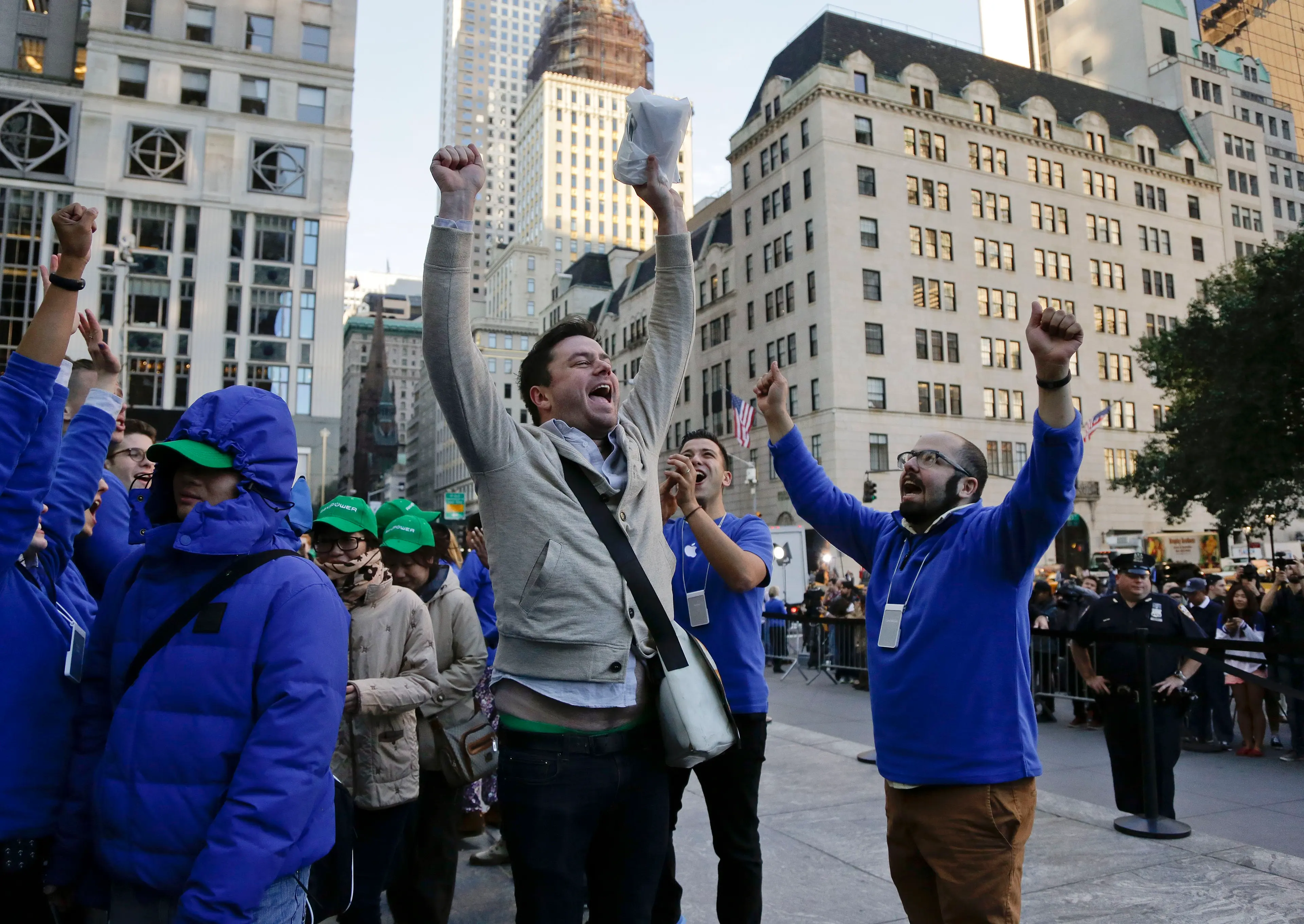 Andreas Gibson celebrates as he exits the Apple store after being the first to purchase an iPhone 6 Plus on Sept. 19, 2014 in New York.