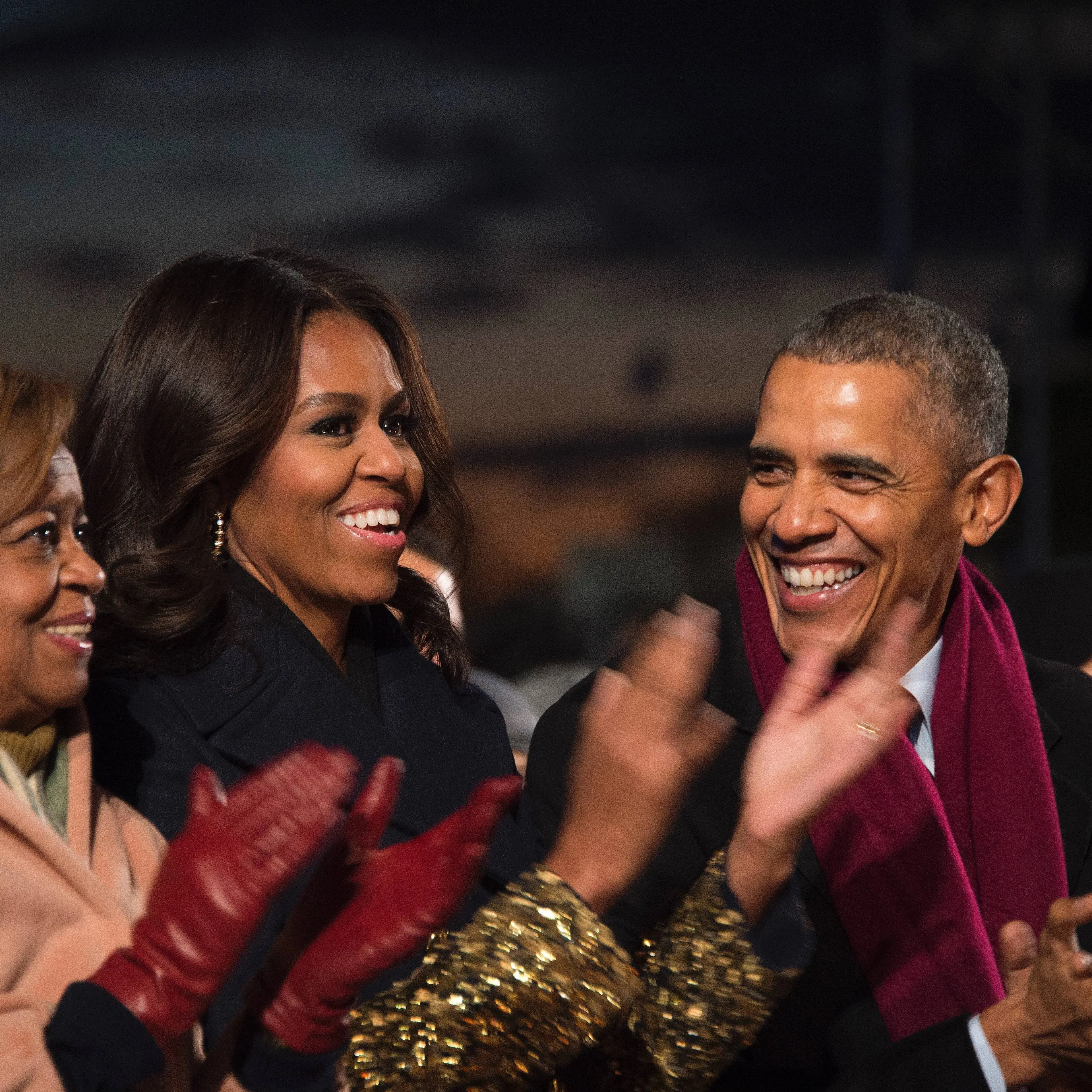 President Barack Obama shares a laugh with First Lady Michelle Obama and his mother-in-law Marion Robinson