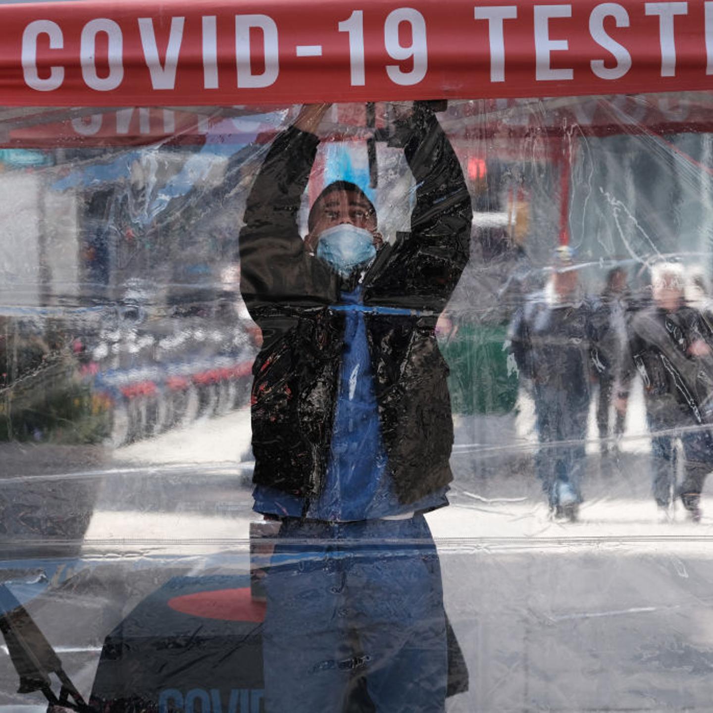 A health care worker at a COVID-19 test site
