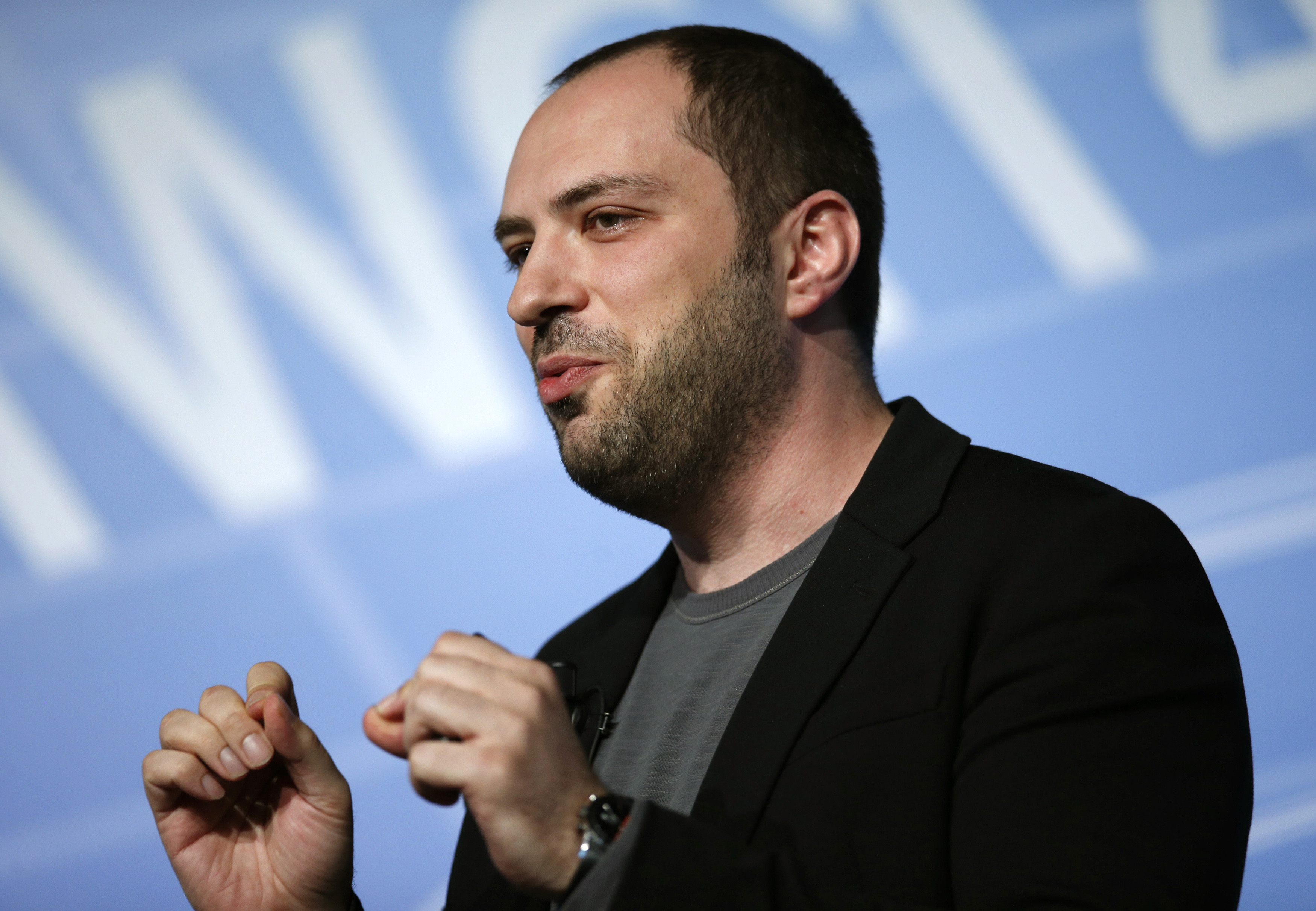 WhatsApp CEO and co-founder Jan Koum delivers a speech at the Mobile World Congress in Barcelona