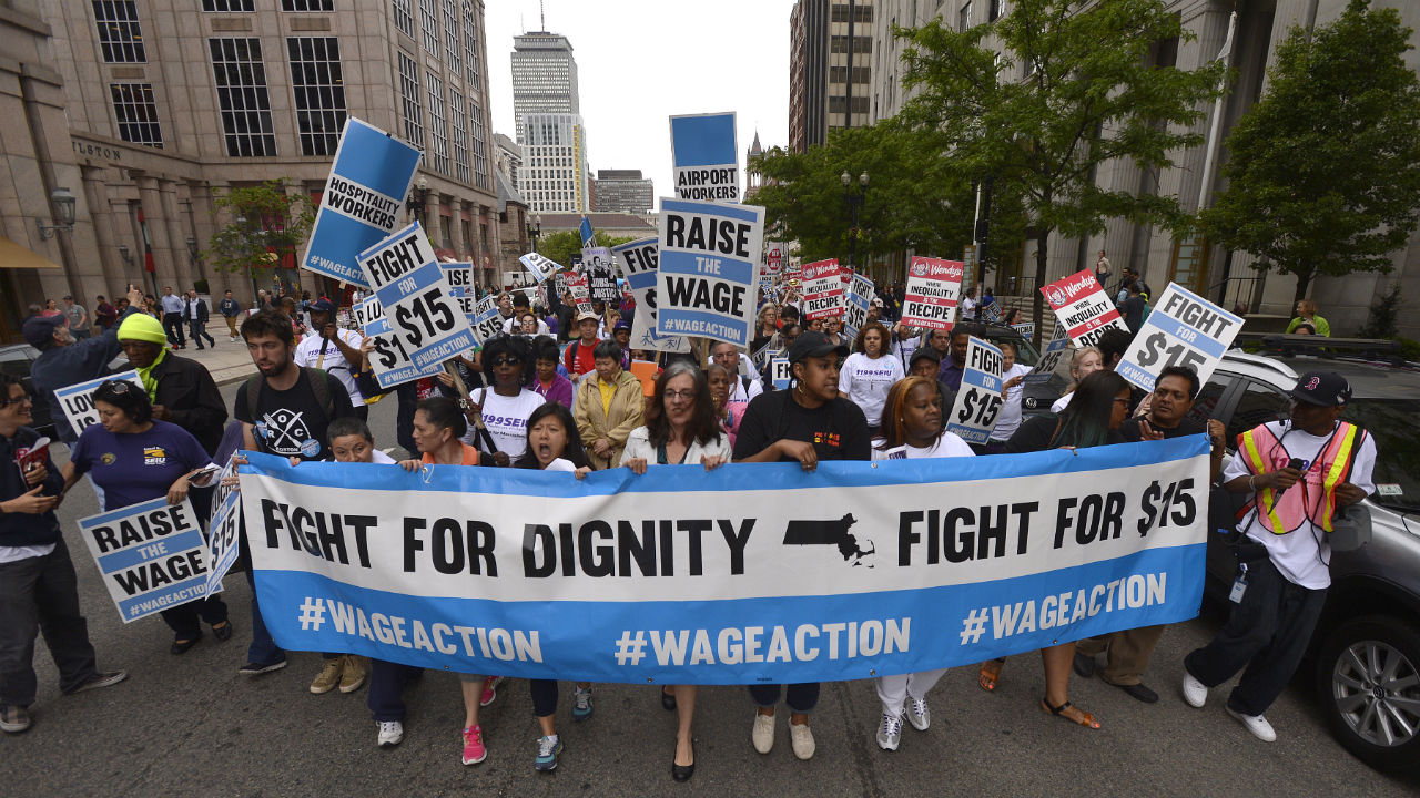Fed up with an ever-widening income gap and inspired by recent national strike actions, hundreds of low-wage workers from multiple industries gathered in Boston, Worcester, and Springfield on June 12, 2014 to demonstrate for higher wages and to protest growing wage inequality. Shown are workers marching on Boylston St from Copley Square toward Legal Sea Food in Park Square. 