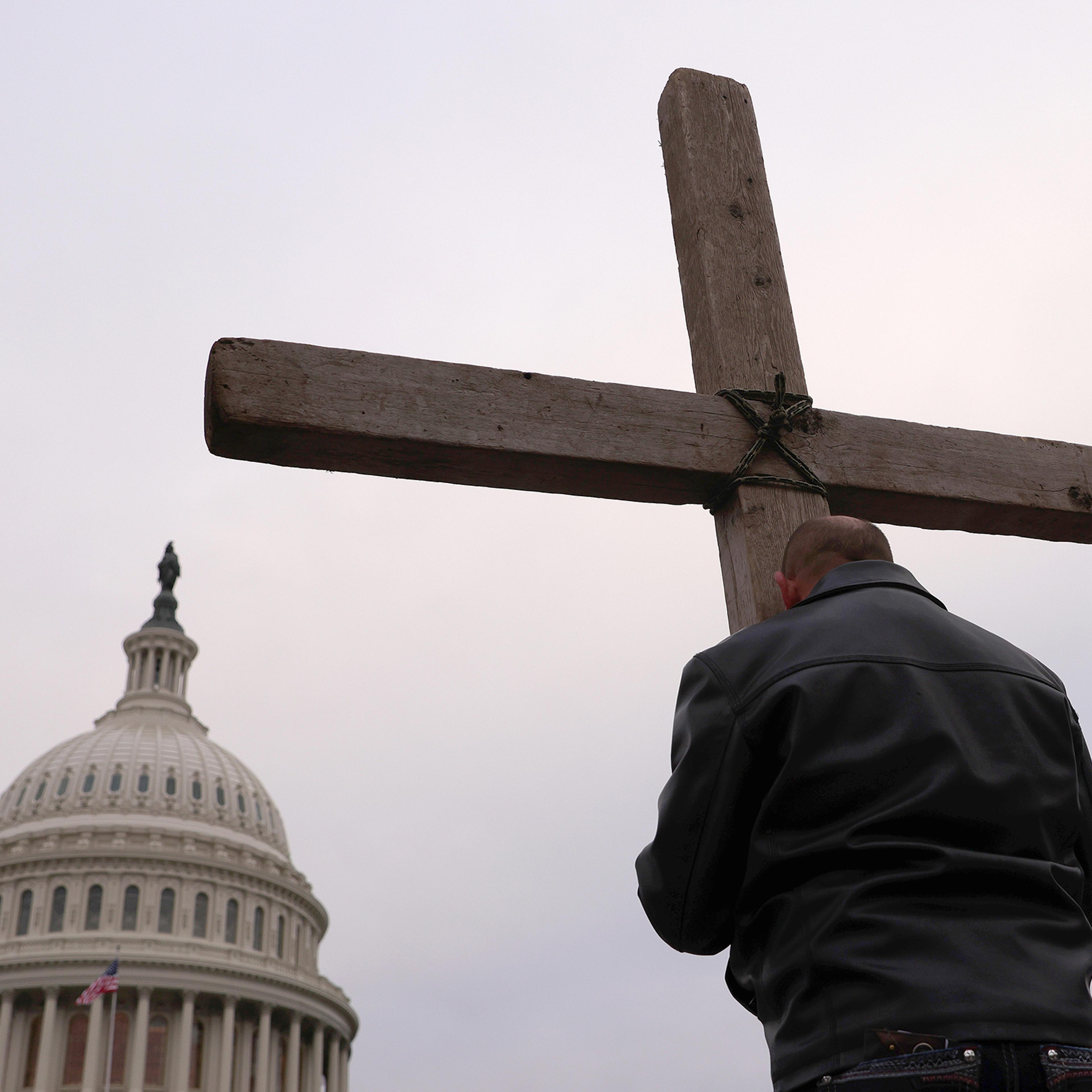 Supporters of U.S. President Donald Trump pray outside the U.S. Capitol Jan. 06 in Washington D.C.