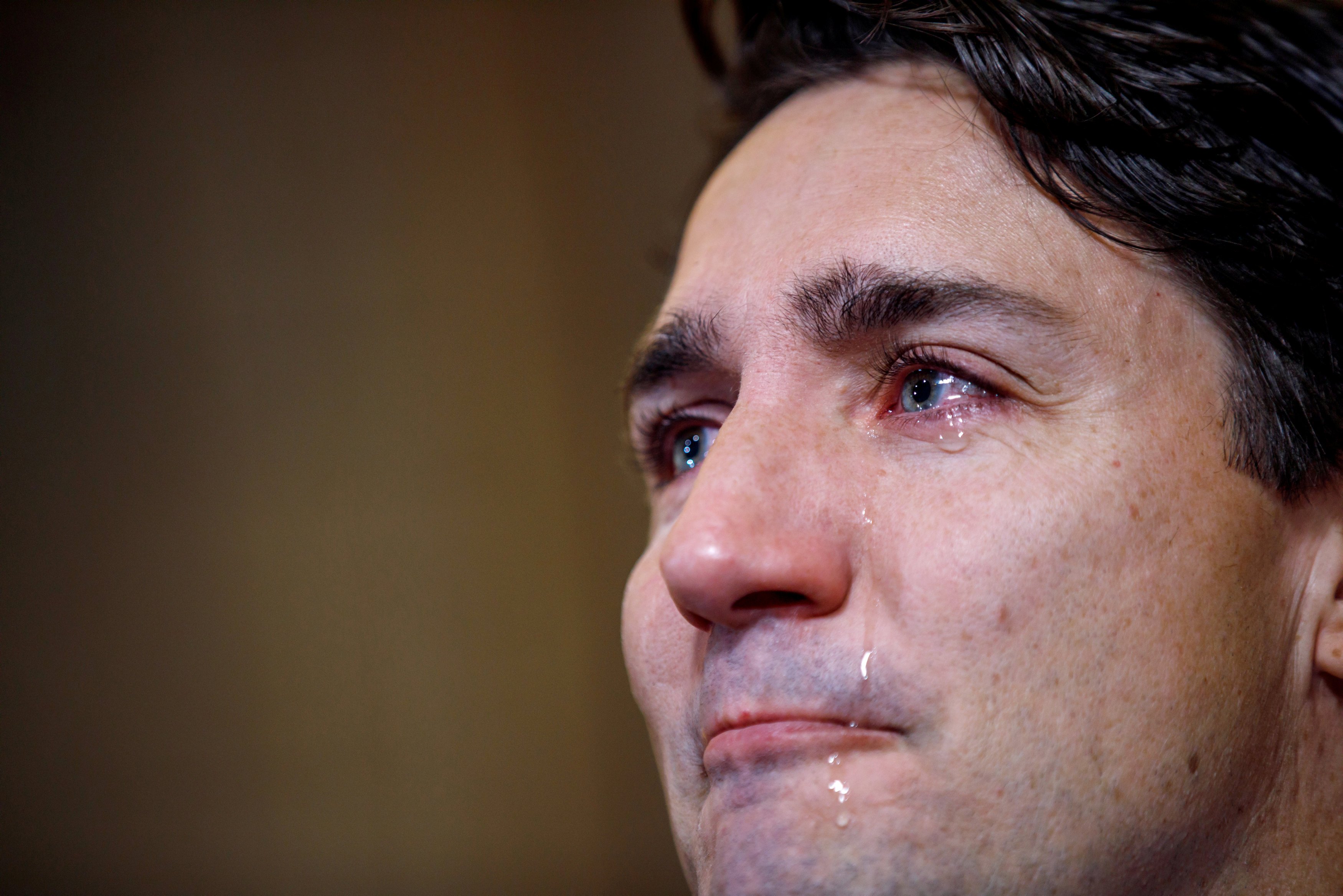 Trudeau sheds tears as he speaks with media about the death of Tragically Hip singer Gord Downie in Ottawa