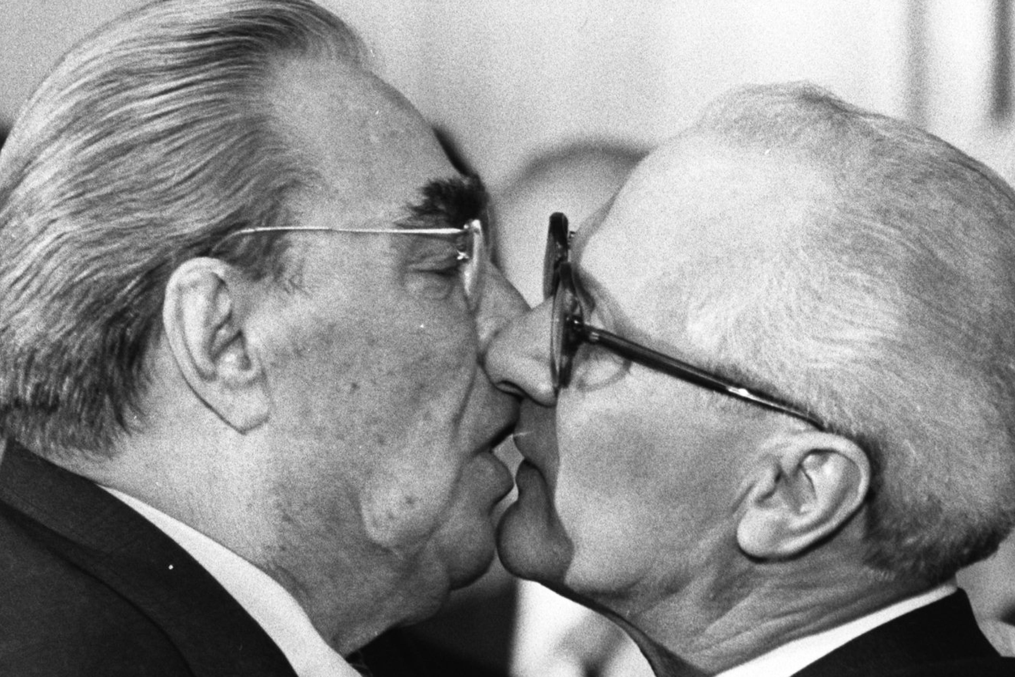 Former Soviet President Leonid Brezhnev and East German leader Erich Honecker exchange a kiss after Brezhnev was honored with the title "Hero of the German Democratic Republik" and the "Karl Marx Medal" in 1979.