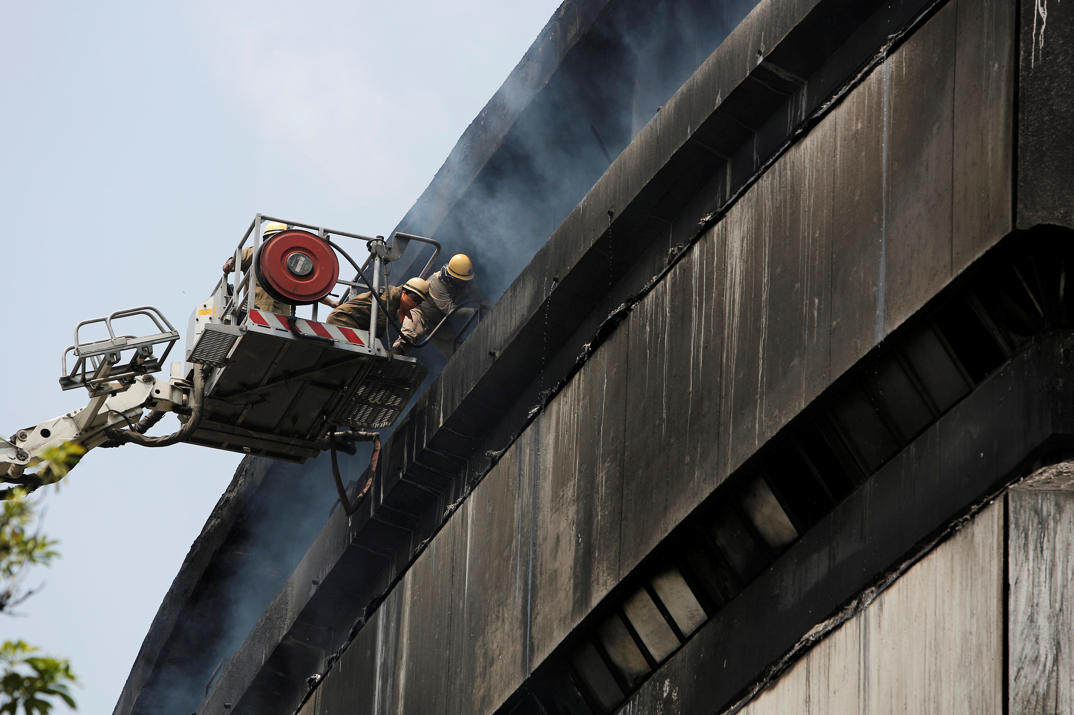 Firefighters work to extinguish fire in the building of India's National Museum of Natural History in New Delhi