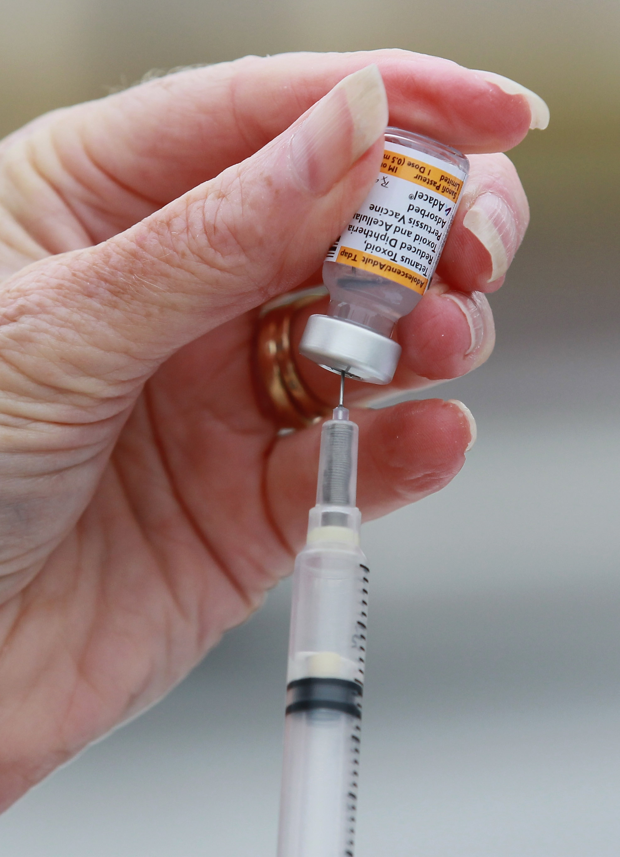 A nurse prepares a Tdap vaccination during the Solano County health fair August 11, 2010 in Vallejo, Calif. According to authorities, an infant died of Whooping Cough in San Diego.