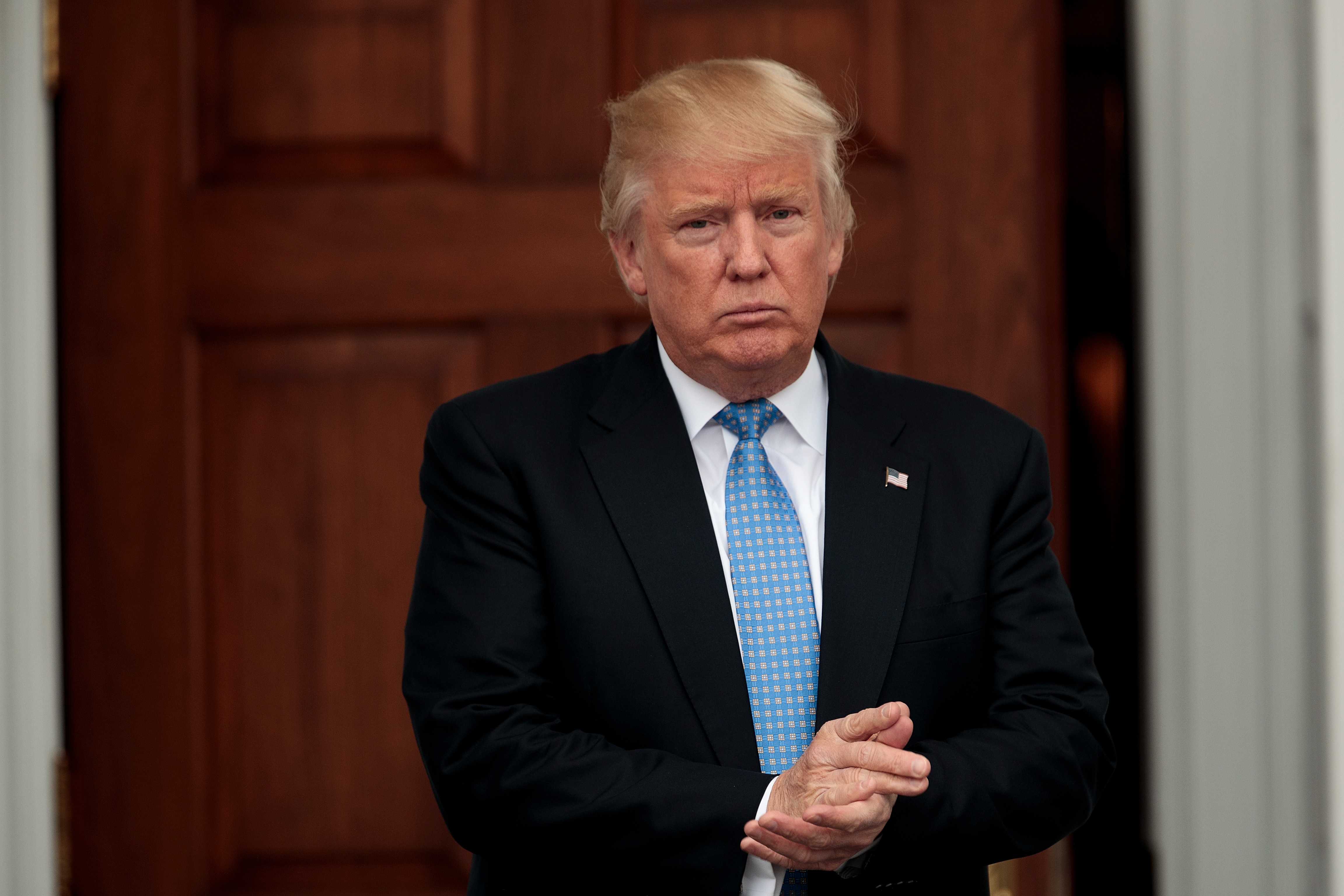 President-elect Donald Trump stands outside the clubhouse following his meeting with Ari Emanuel, co-CEO of William Morris Endeavor, at Trump International Golf Club, in Bedminster Township, N.J., on Nov. 20, 2016.