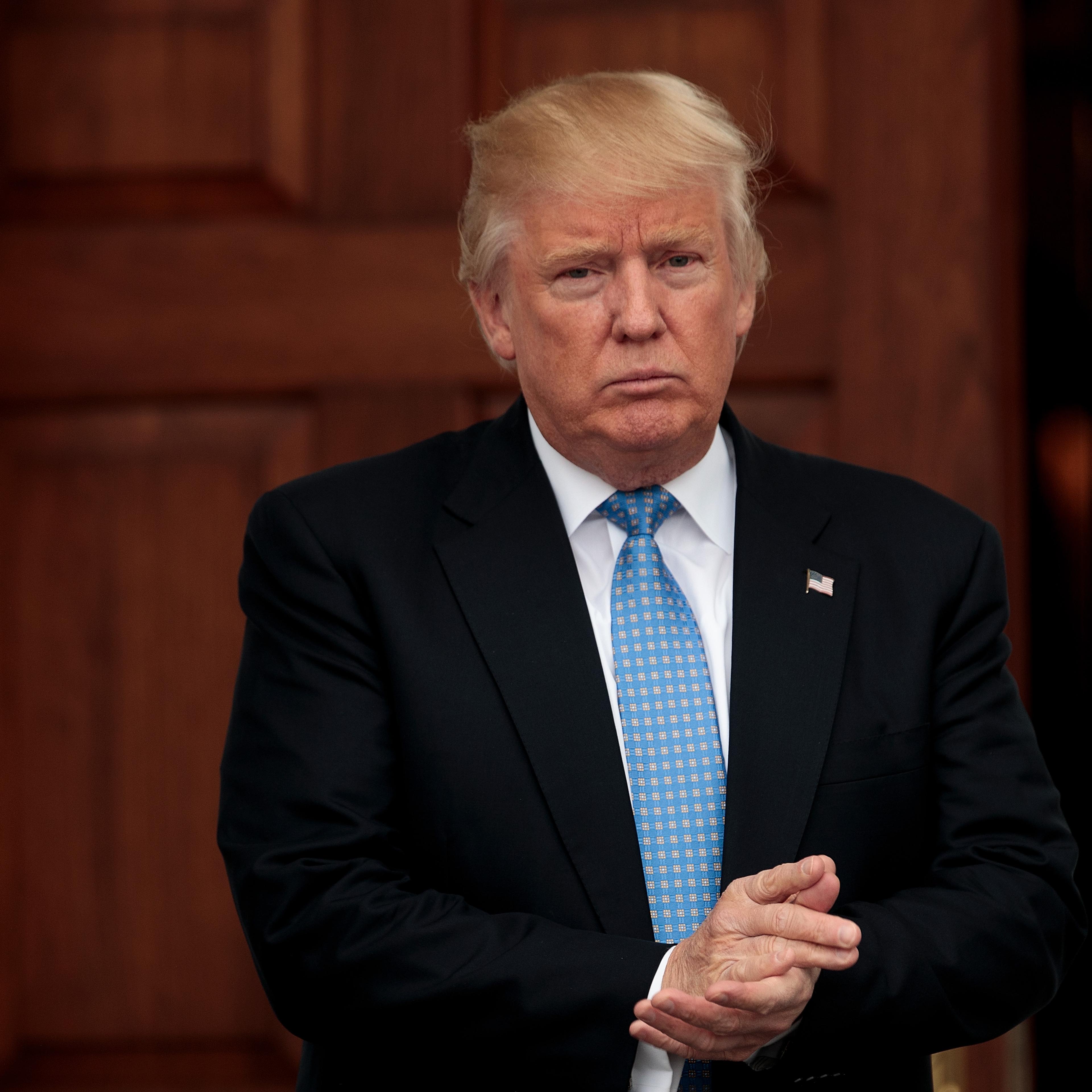 President-elect Donald Trump stands outside the clubhouse following his meeting with Ari Emanuel, co-CEO of William Morris Endeavor, at Trump International Golf Club, in Bedminster Township, N.J., on Nov. 20, 2016.