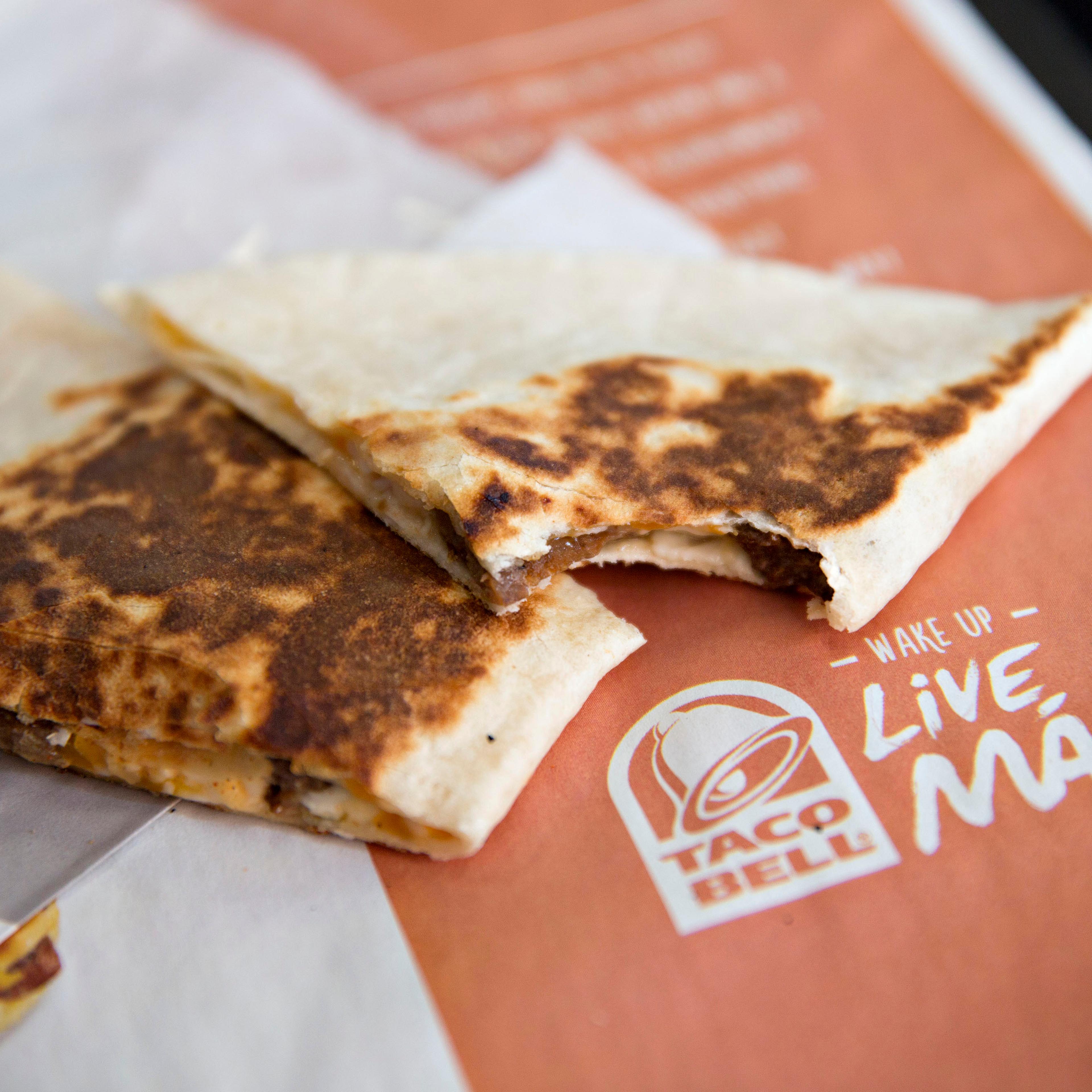 Food is arranged for a photograph at a Taco Bell restaurant in Peru, Illinois, U.S., on Thursday, Oct. 1, 2015. Yum! Brands Inc., owner of restaurant brands KFC, Pizza Hut, and Taco Bell, is scheduled to release third-quarter earnings on October 6.
