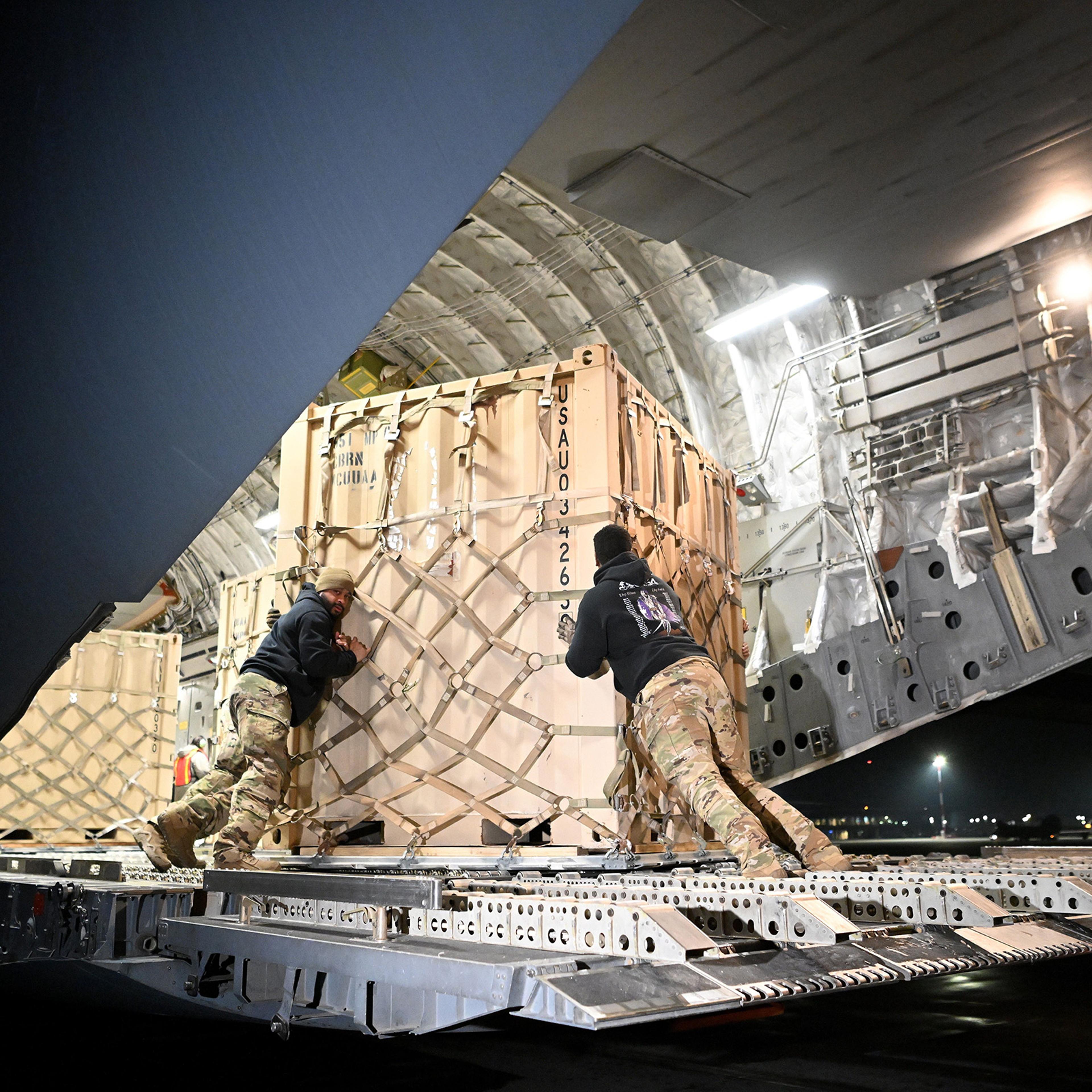 A U.S. military cargo plane transporting supplies bound for Ukraine is unloaded in February at an airfield in Rzeszow, Poland