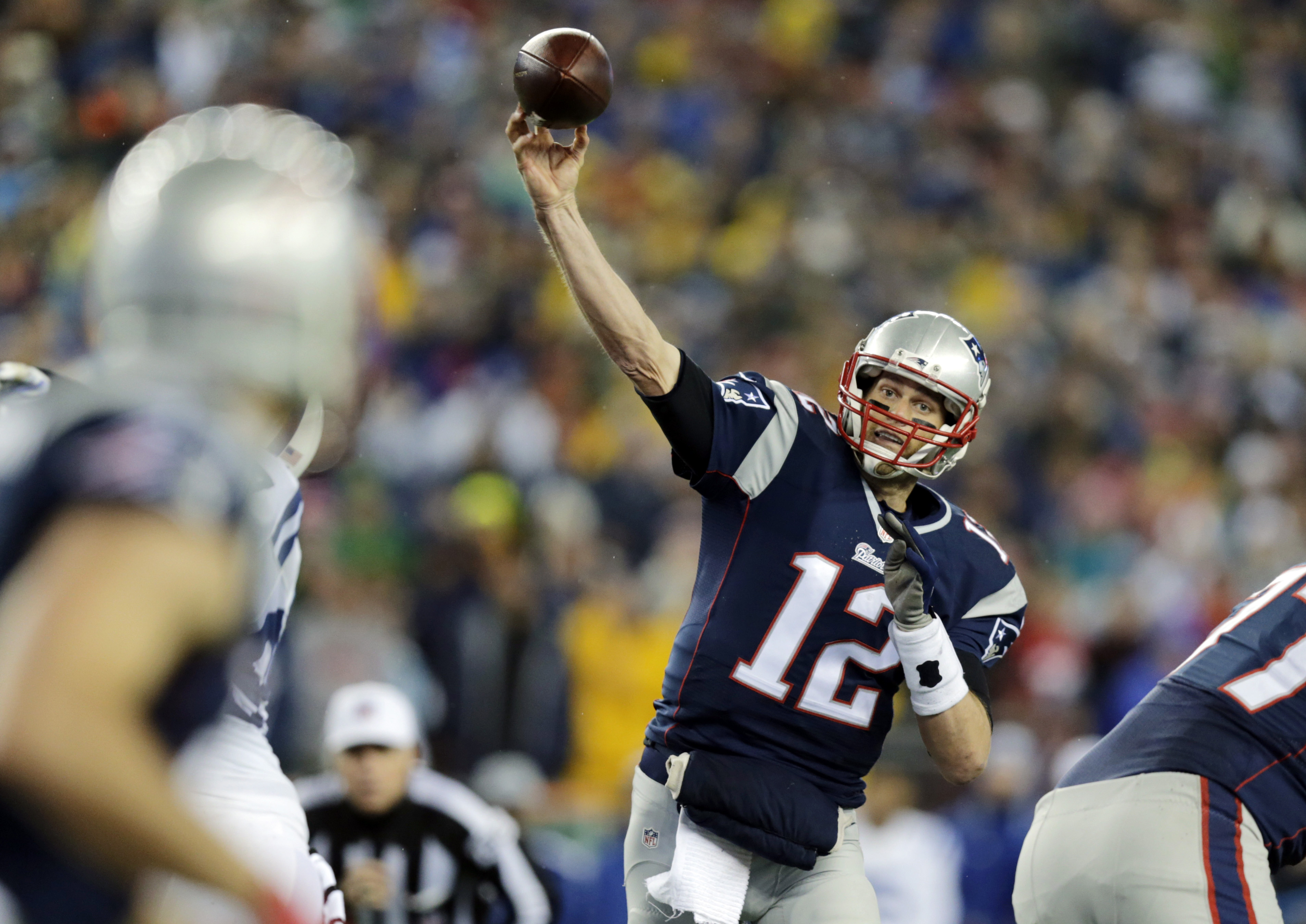 New England Patriots quarterback Tom Brady throws a pass during the first half of the AFC championship NFL football game against the Indianapolis Colts in Foxborough, Mass on Jan. 18, 2015.