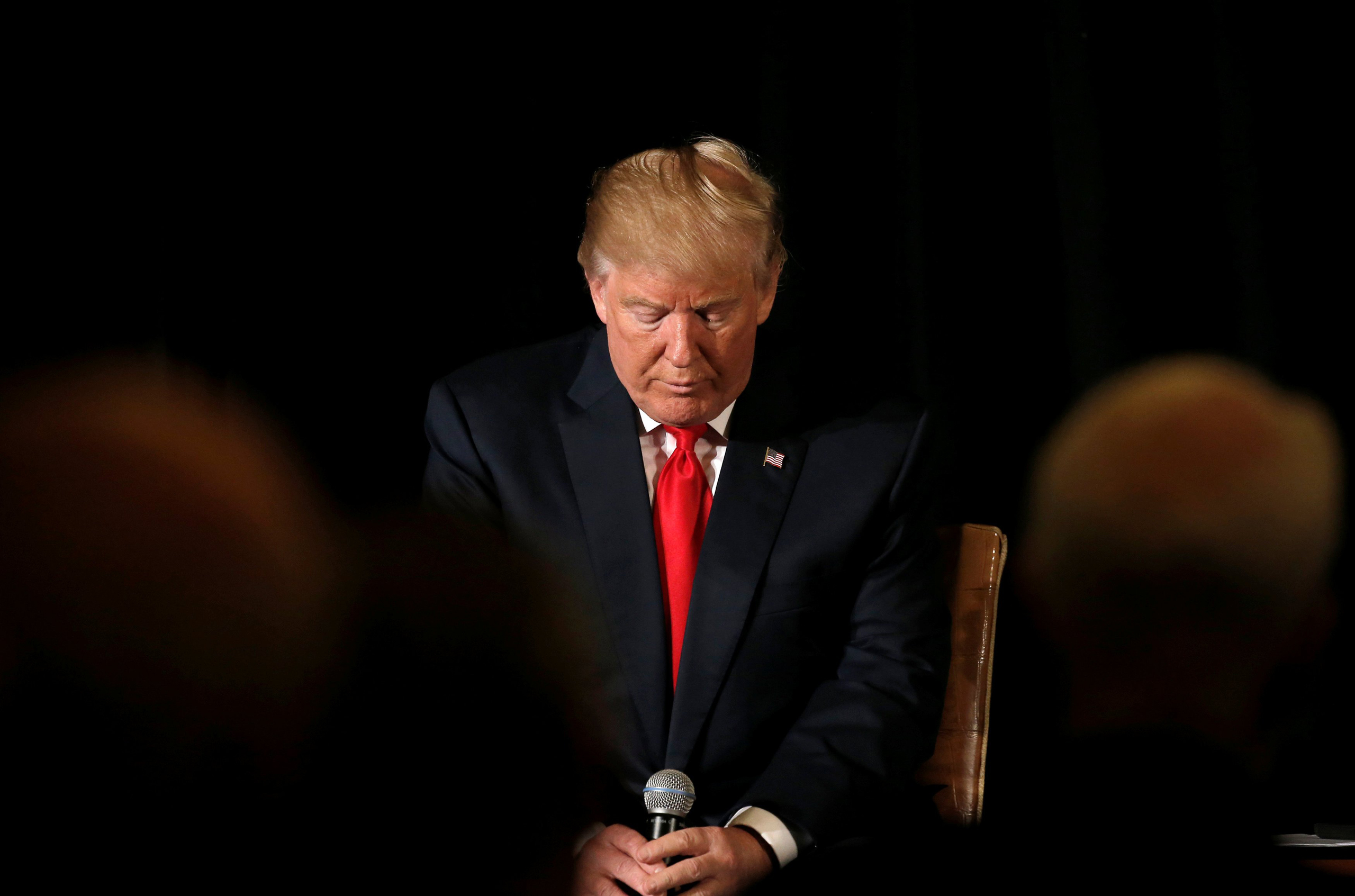 Republican presidential nominee Donald Trump pauses before answering questions at the "Retired American Warriors" conference during a campaign stop in Herndon