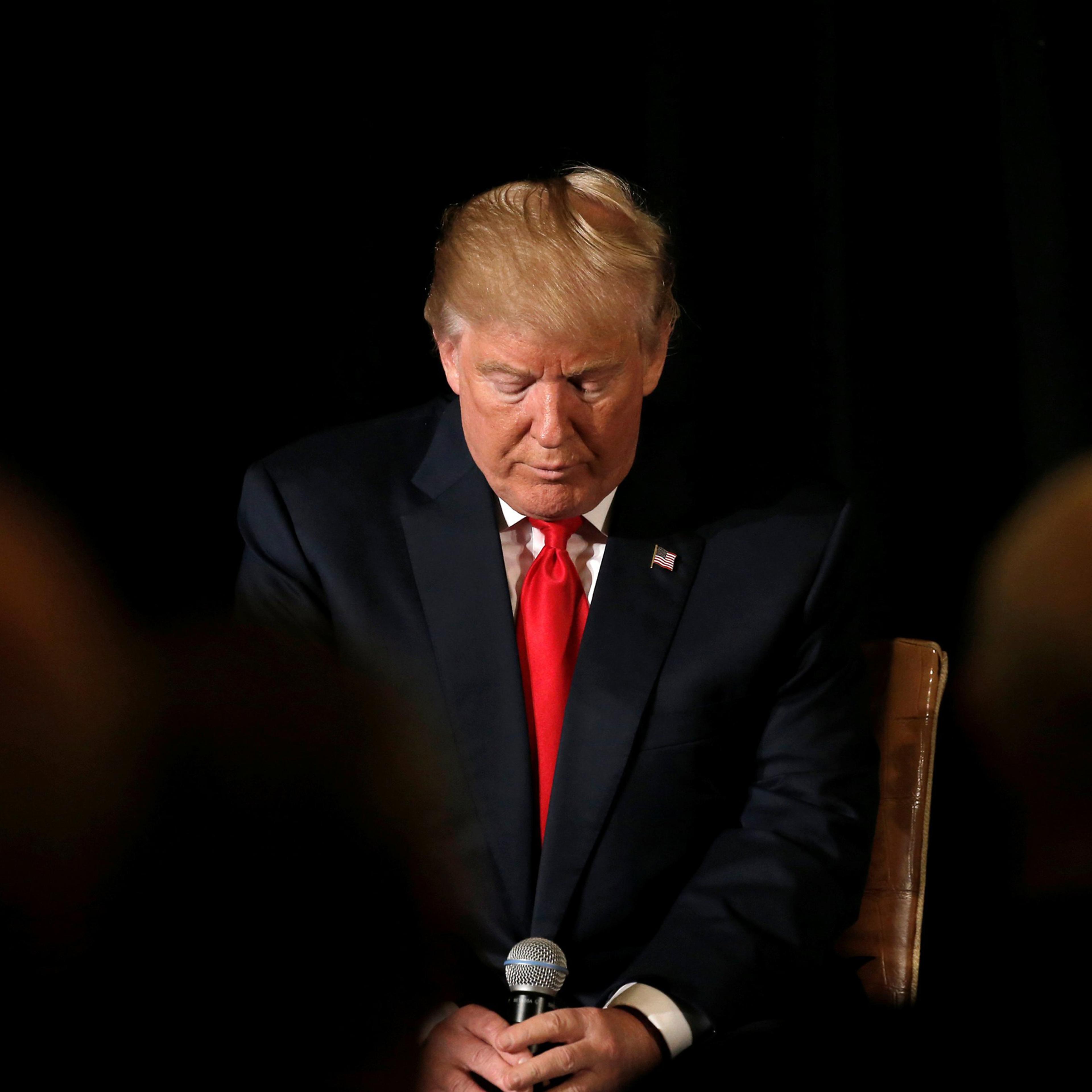 Republican presidential nominee Donald Trump pauses before answering questions at the "Retired American Warriors" conference during a campaign stop in Herndon