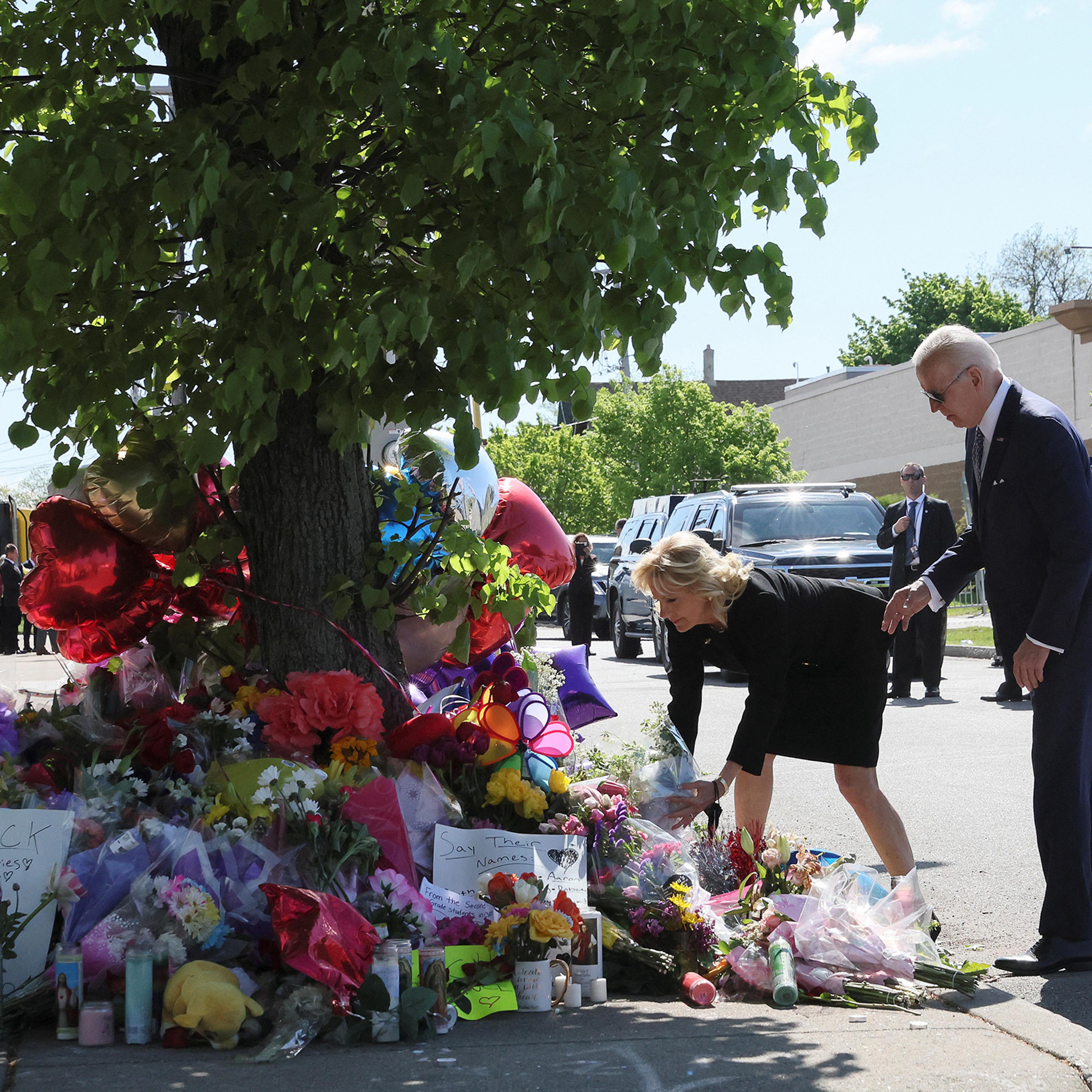 U.S. President Joe Biden and first lady Jill Biden pay their respects to the 10 people killed in a mass shooting by a gunman authorities say was motivated by racism, at the Tops Friendly Markets memorial site in Buffalo, N.Y. on May 17.