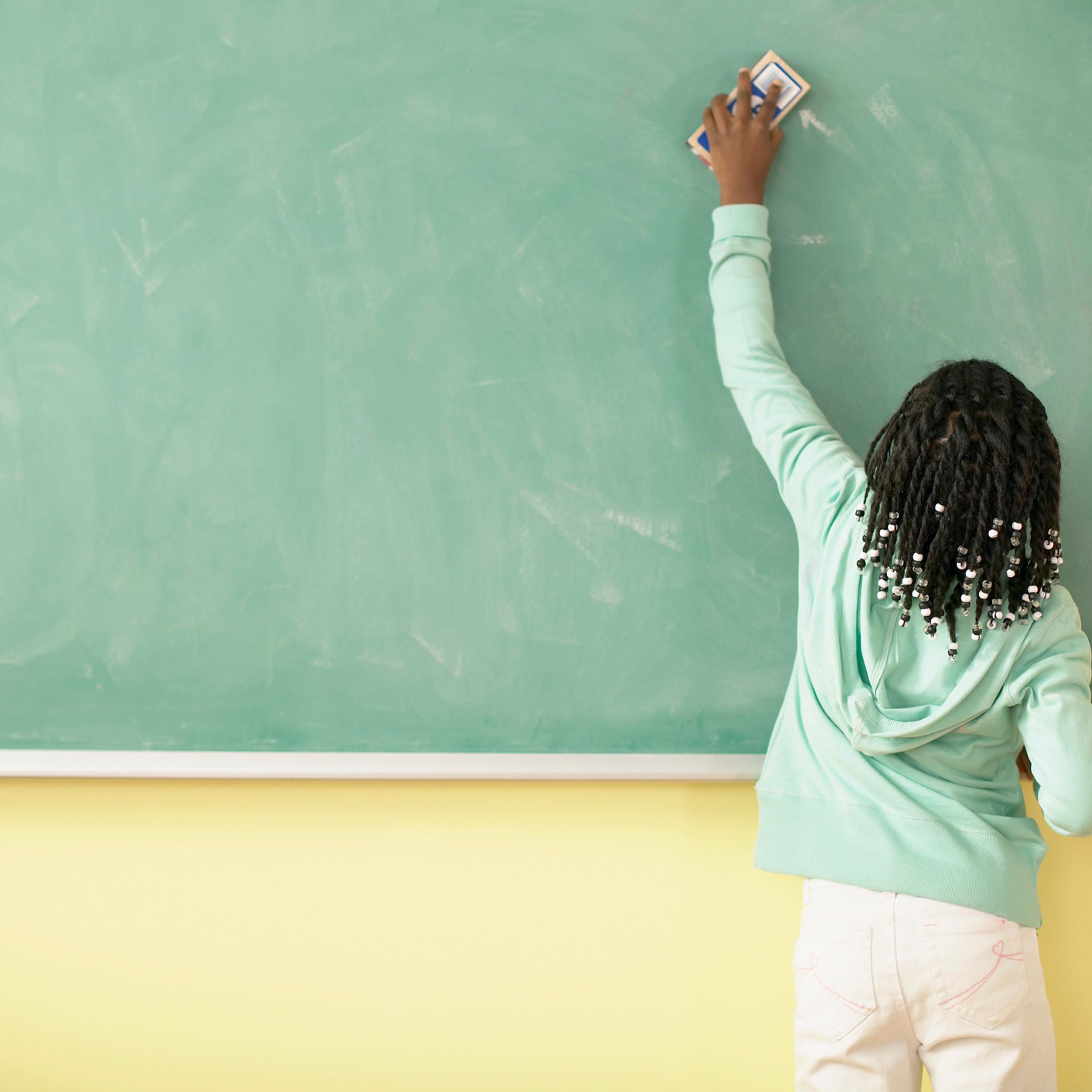 Girl Erasing Blackboard