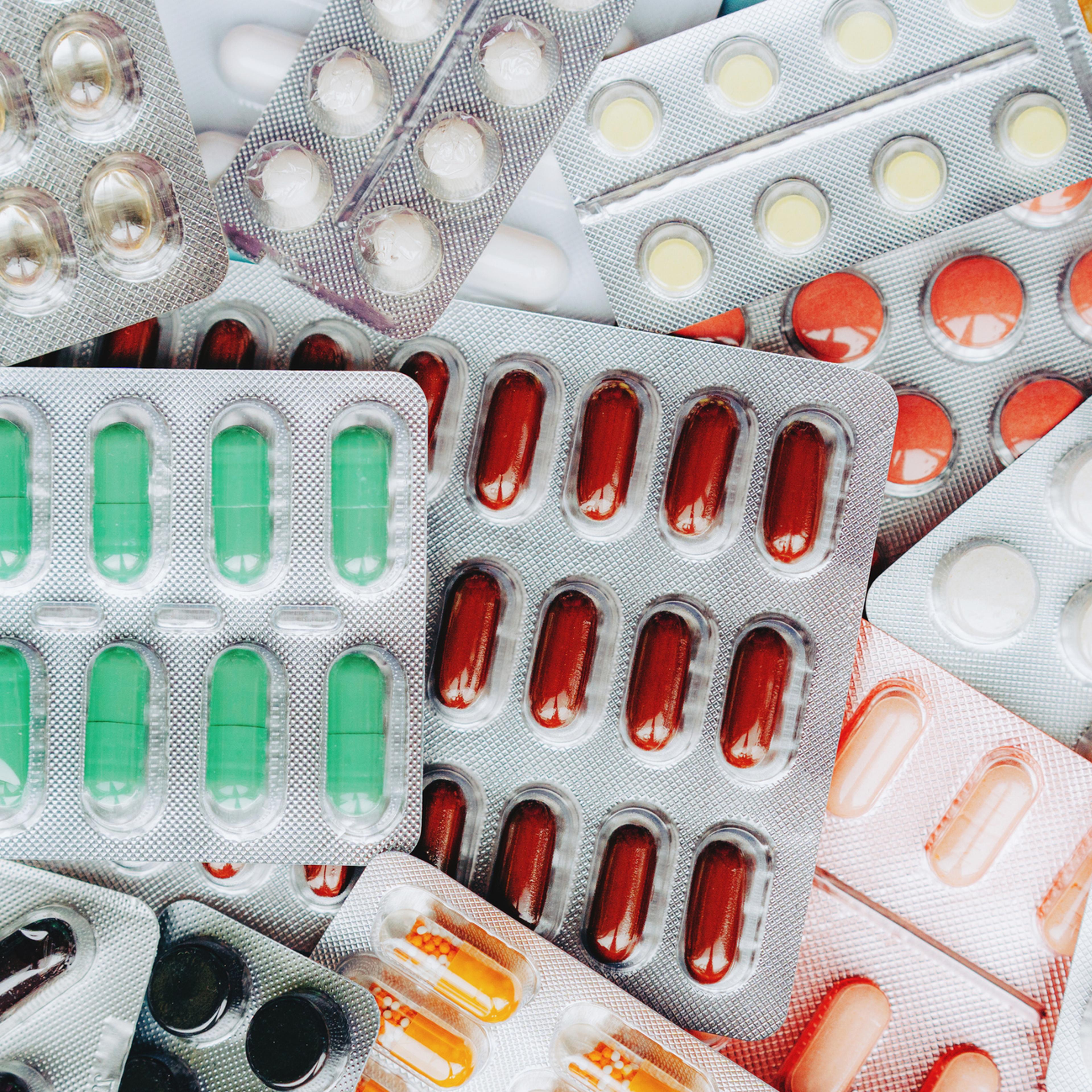A large group of assorted pills and blister packs.