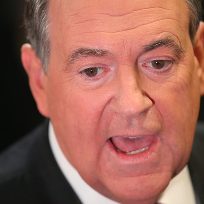 Republican presidential candidate Mike Huckabee talks to reporters in the spin room after the first part of the Fox Business Network Republican presidential debate at the North Charleston Coliseum and Performing Arts Center on January 14, 2016 in North C