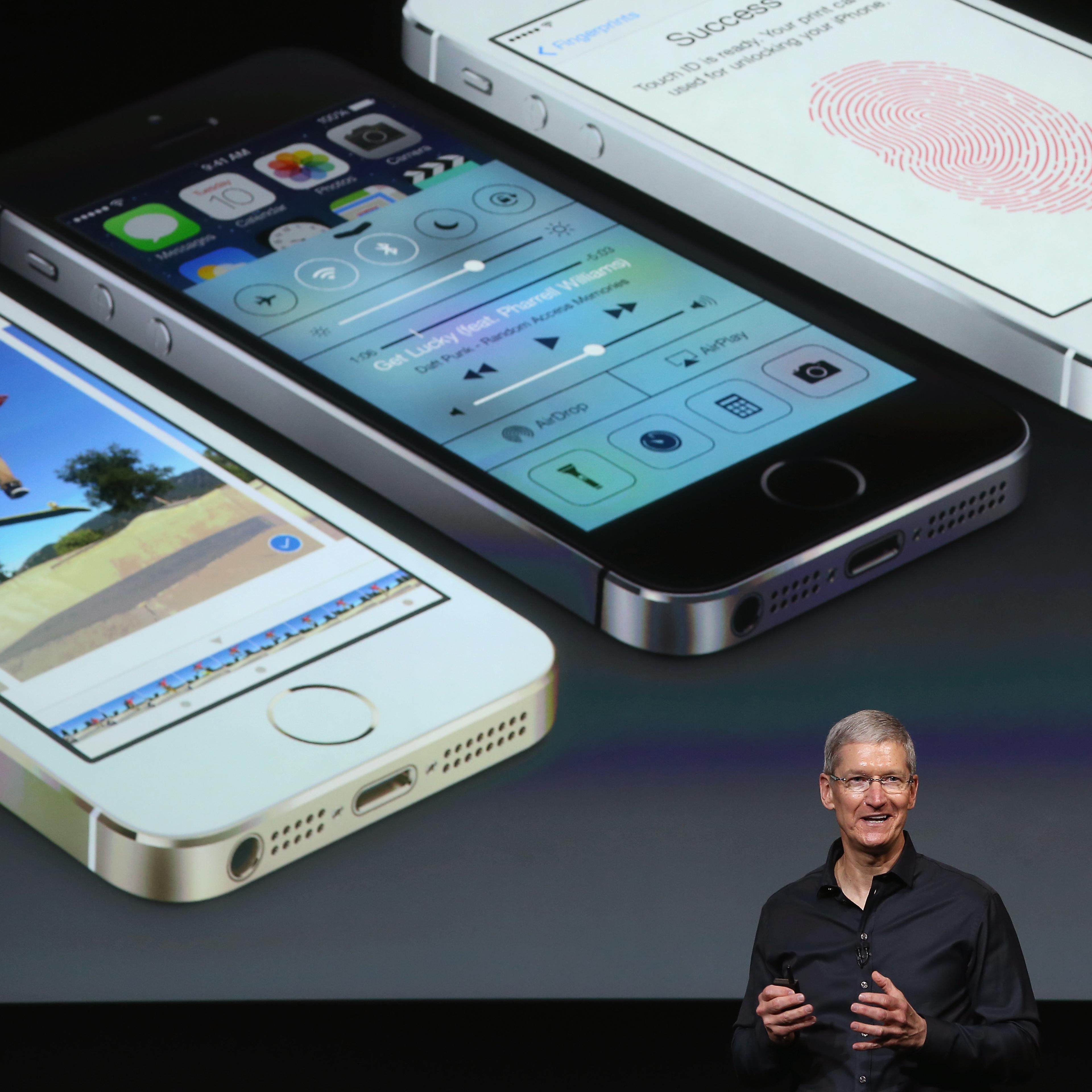 Apple CEO Tim Cook speaks about the new iPhone during an Apple product announcement at the Apple campus on September 10, 2013 in Cupertino, California.