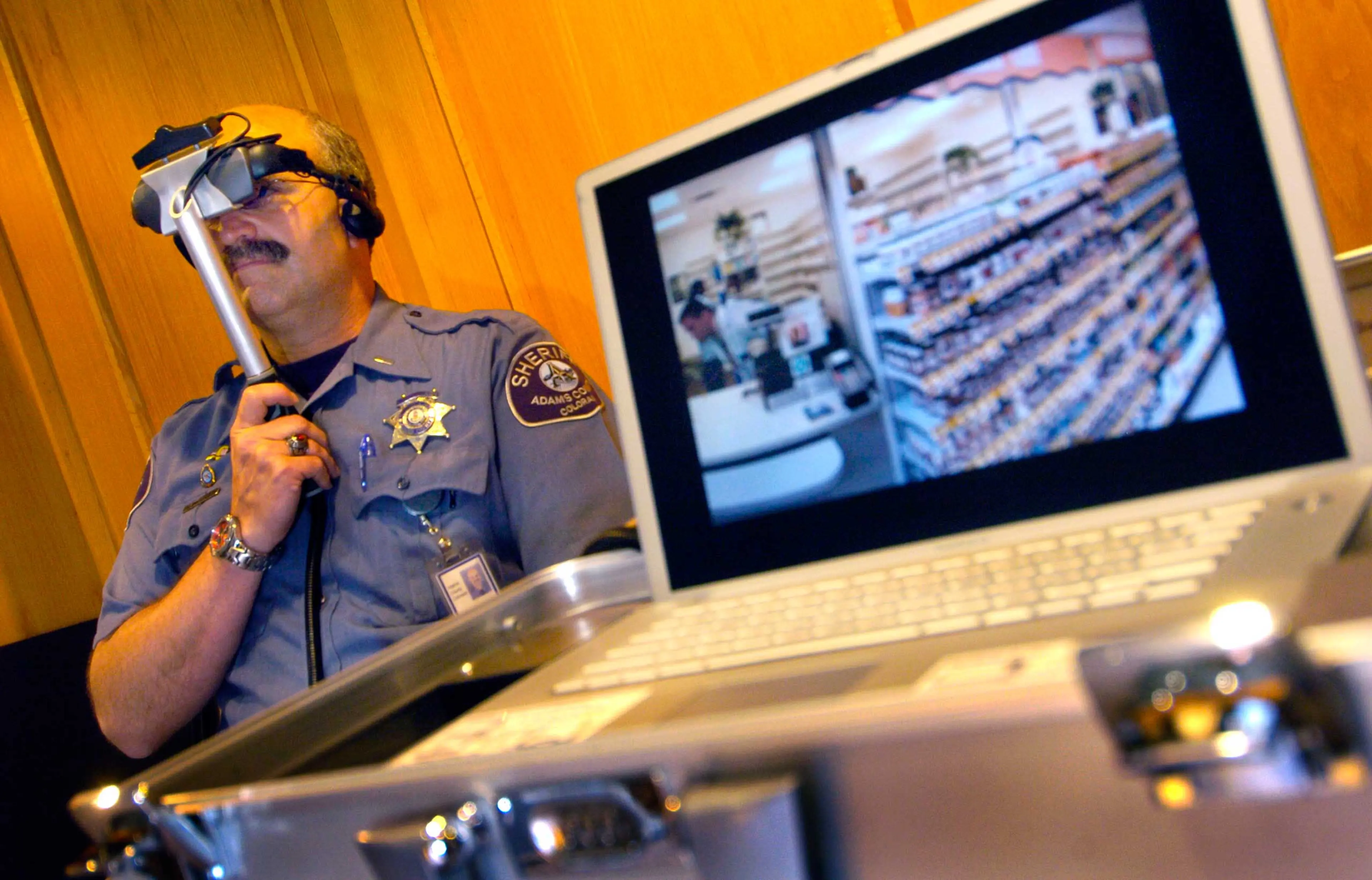 Lt. David Shipley of the Adams County Sheriff's Department watched an interactive video that replicated the experiences of a schizophrenic patient having auditory and visual hallucinations while attempting to refill a prescription at a pharmacy.