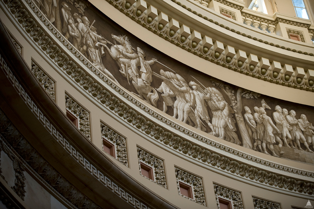 The Frieze of American History in the Rotunda of the United States Capitol, seen ca. 2011, contains a painted panorama depicting significant events in American history. The frieze's 19 scenes is the work of three artists: Constantino Brumidi, Filippo Constaggini and Allyn Cox. 