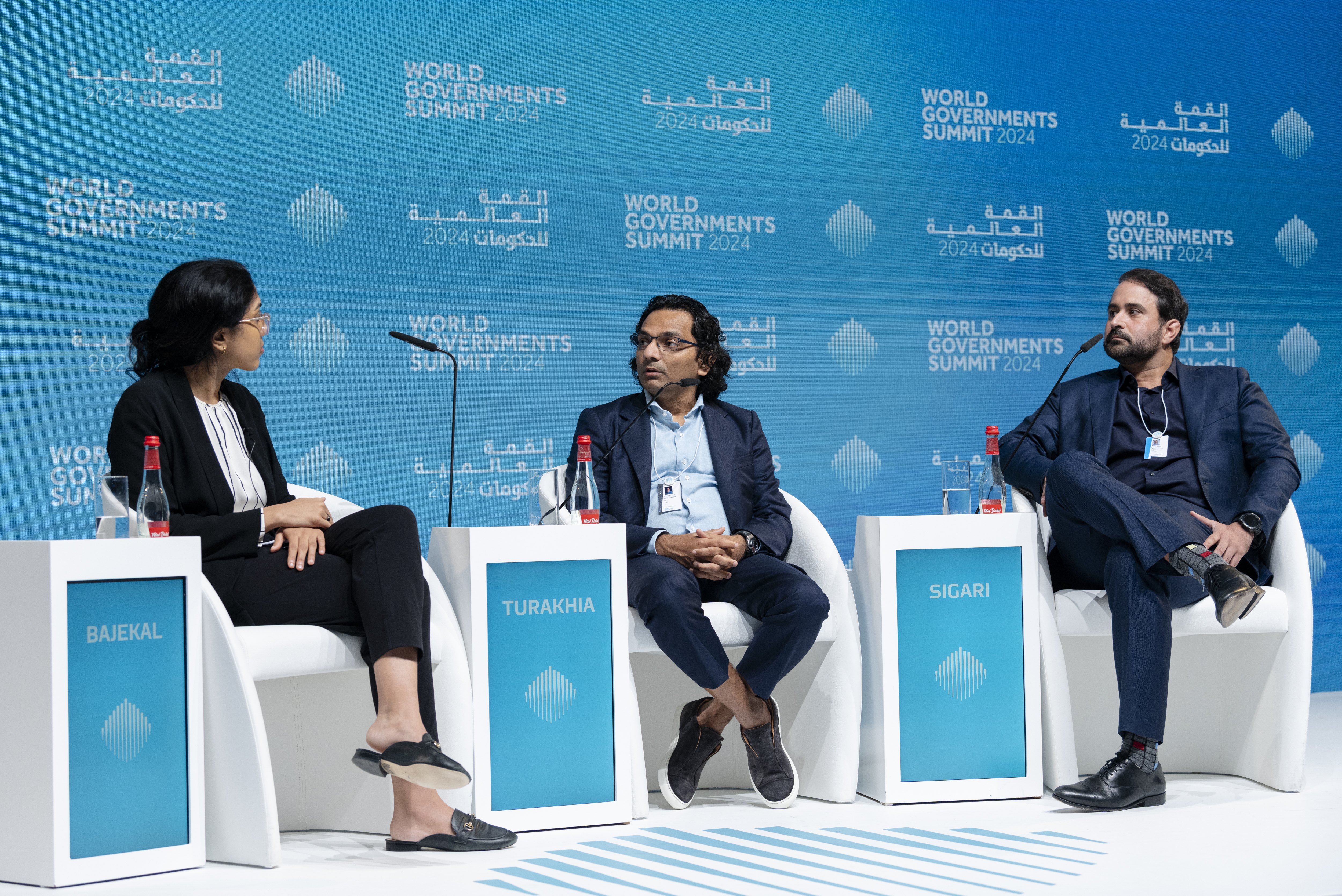 Panel discussion on the global investment outlook for 2024 at the World Governments Summit in Dubai on Feb. 14. From left: TIME Executive Editor Naina Bajekal, Founder of AI.tech Div Turakhia, and Cyrus Sigari, Co-Founder and Managing Partner at UP Partners. 