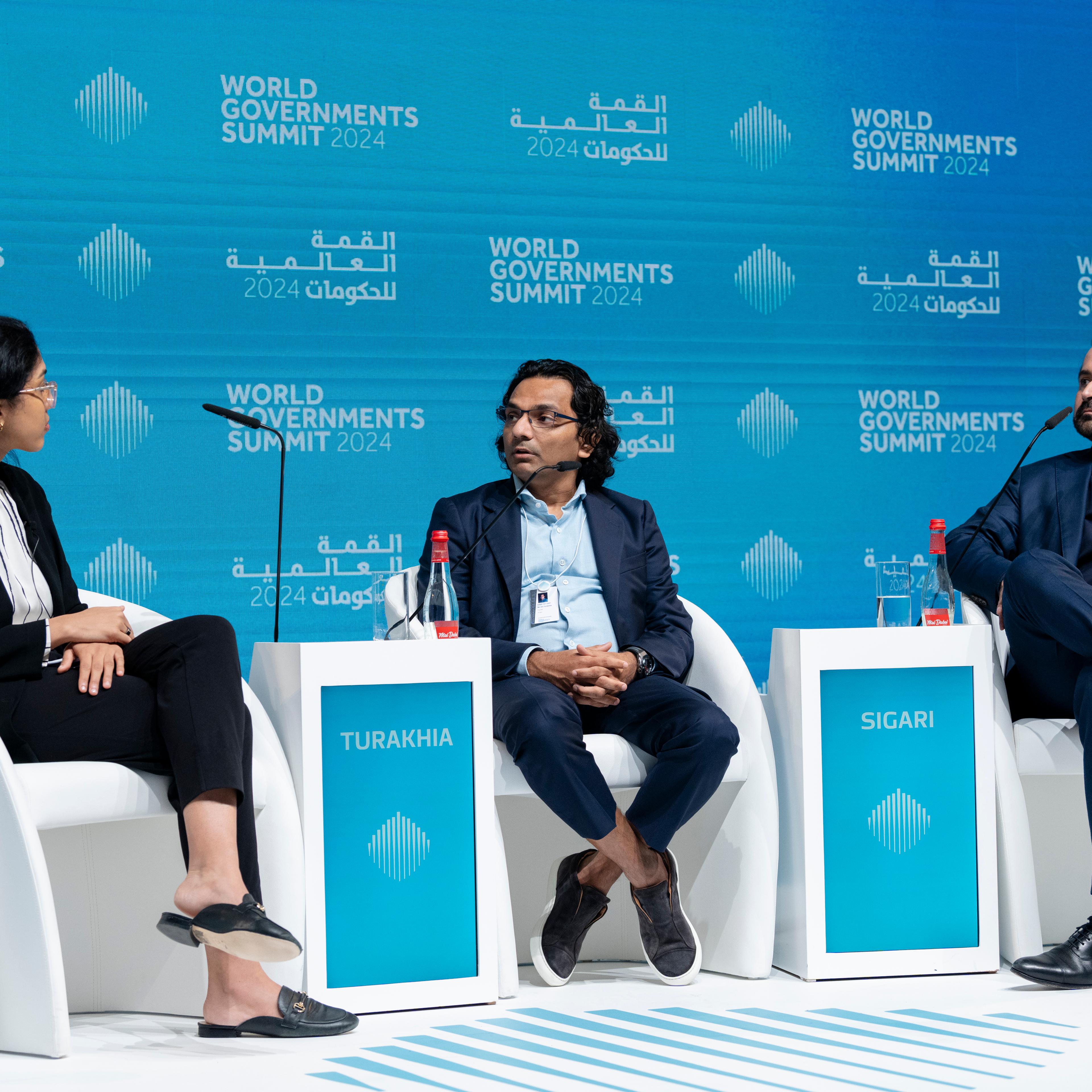 Panel discussion on the global investment outlook for 2024 at the World Governments Summit in Dubai on Feb. 14. From left: TIME Executive Editor Naina Bajekal, Founder of AI.tech Div Turakhia, and Cyrus Sigari, Co-Founder and Managing Partner at UP Partners.