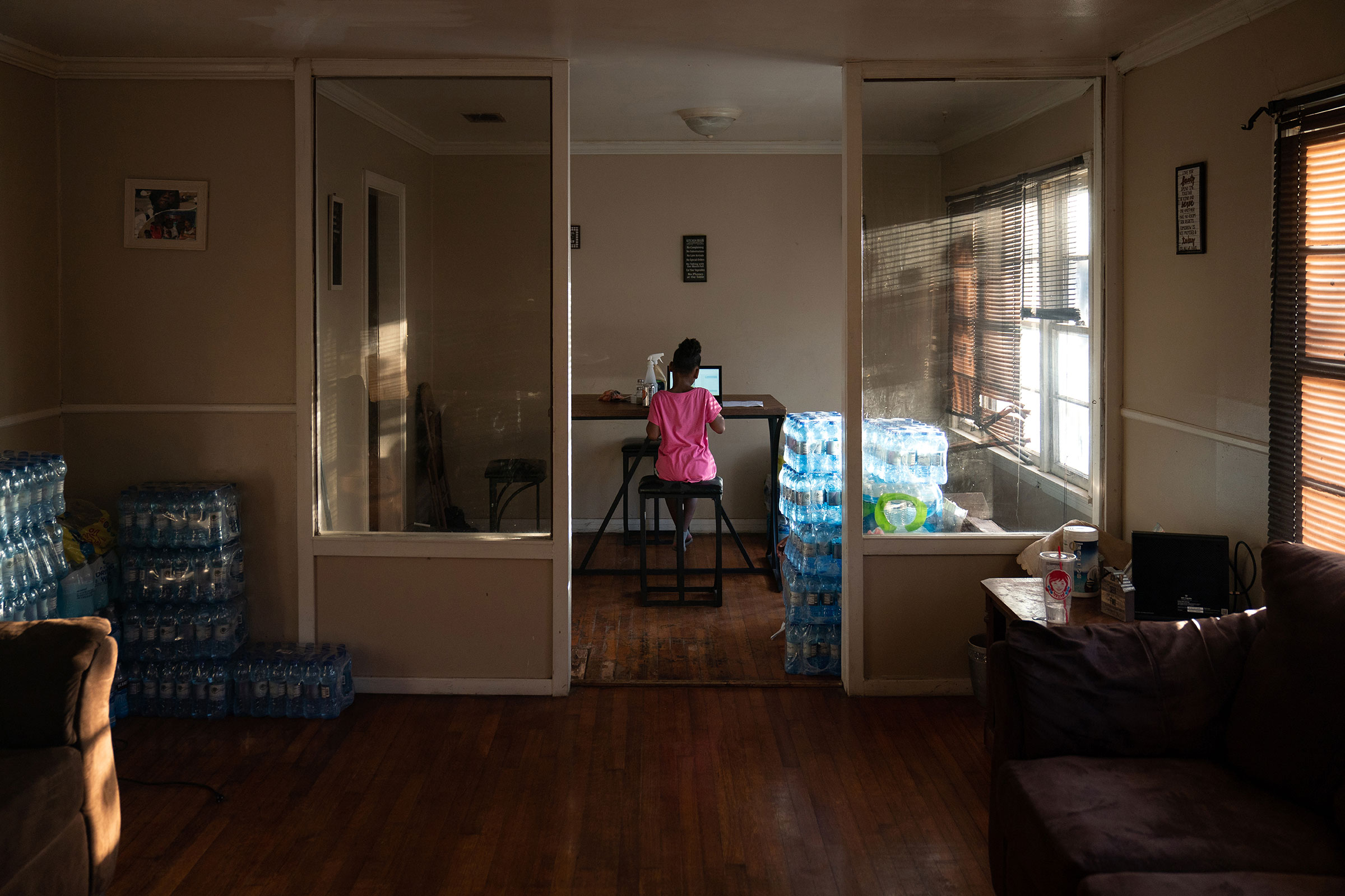 Ma’kayla Jackson uses a laptop in grandmother’s dining room in Jackson, Miss. on Jan. 5.